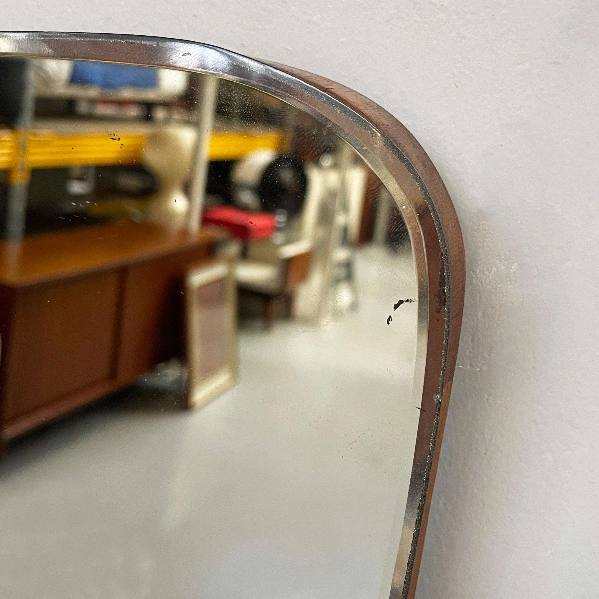 Wood Italian mid-century modern Shaped wall mirror in wood and metal, 1950s
