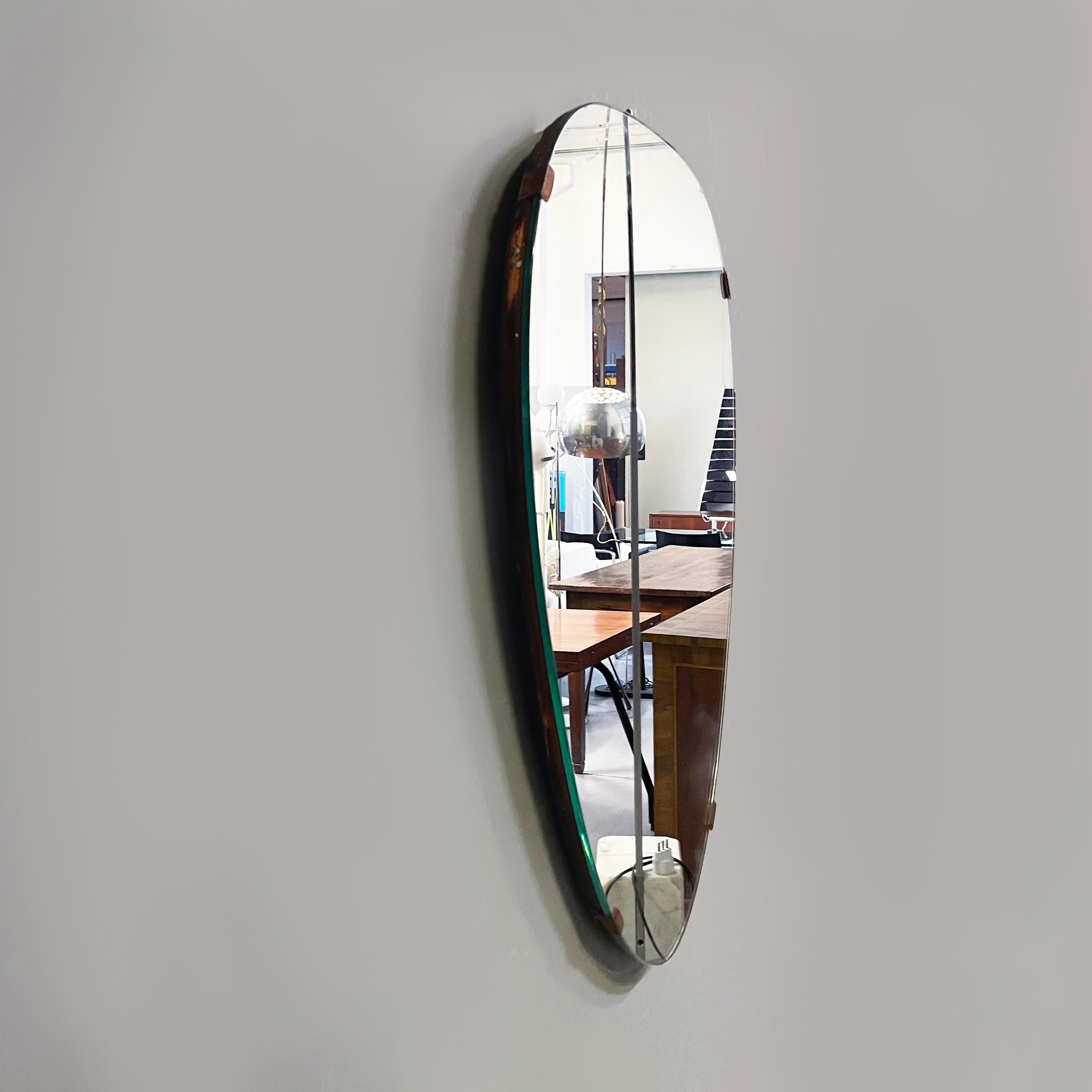 Mid-Century Modern Italian mid-century modern Shield-shape wall mirror with brass details, 1960s For Sale