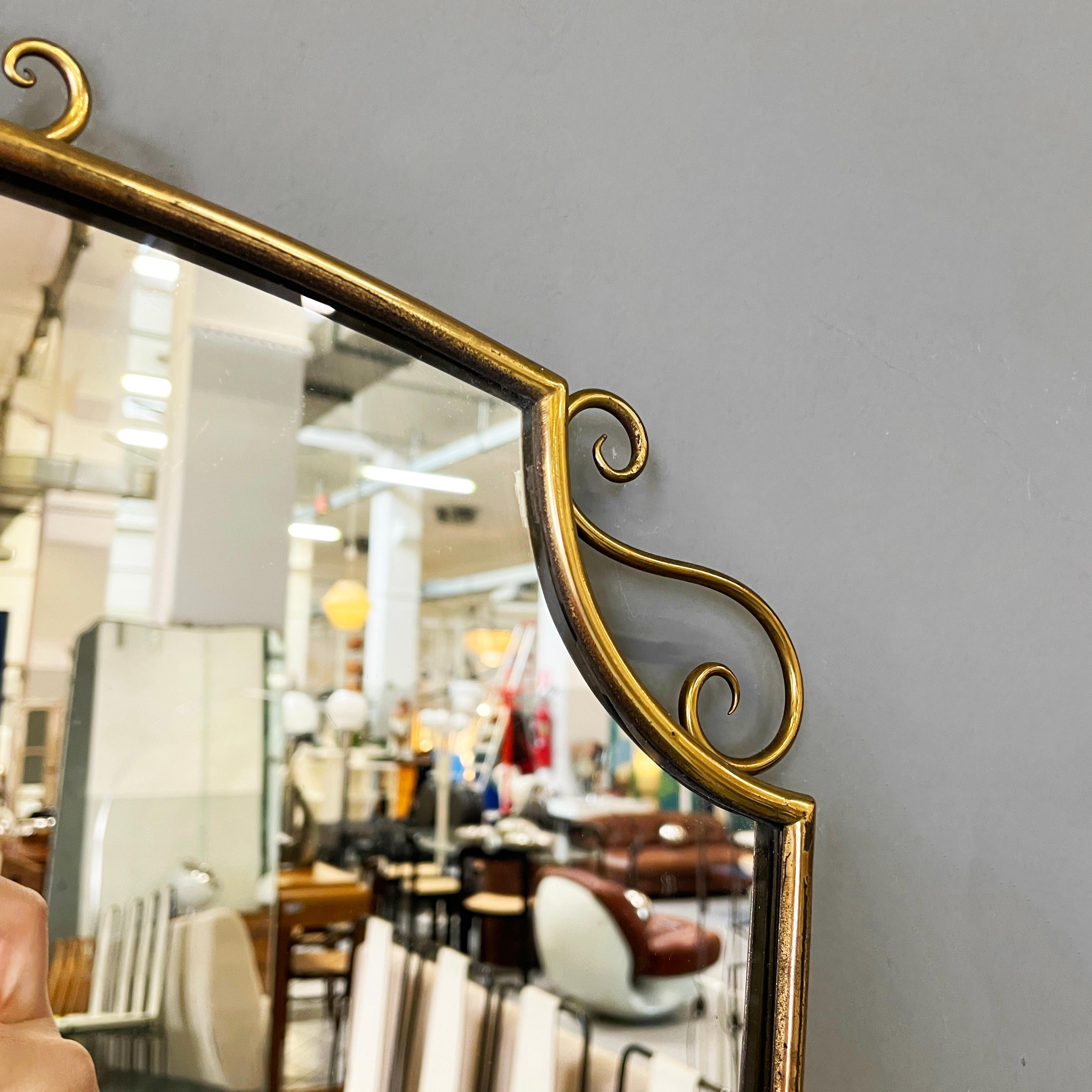 Brass Italian mid-century modern Shield-shaped wall mirror with brass frame, 1950s