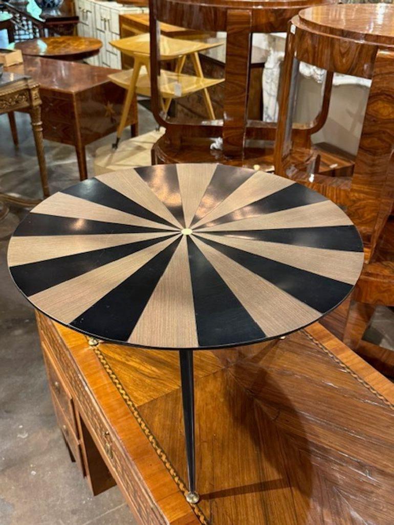 The product is a stylish Italian mid-century modern mirror with a frame finish in ebony and white oak. The timeless elegance of the Italian design and the contrast of the ebony and white oak materials make this piece a standout addition to any