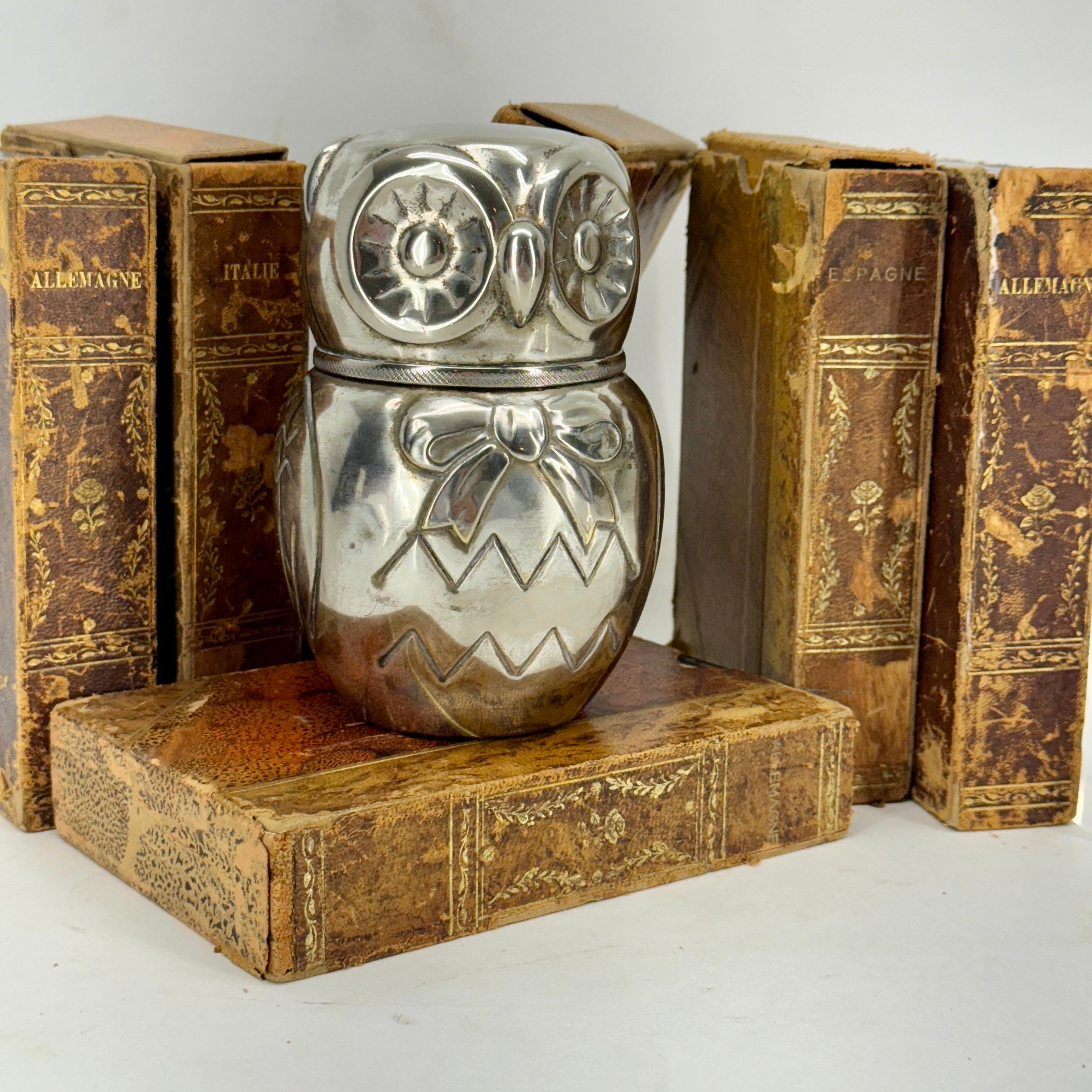 Vintage Money Bank of an Owl in Italian Silver Plate.
This charming money bank comes in two parts that is easily opened. This bank is very functional as a bank but also wonderful displayed on a bookshelf. Great gift for the owl collector in your