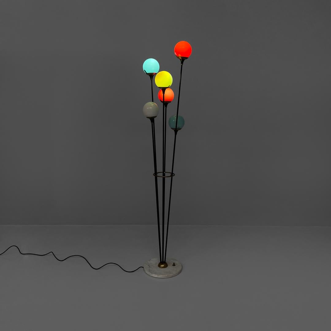Italian mid-century modern six diffusers floor lamp Alberello by Stilnovo 1950s 
Floor lamp mod. Alberello with a round base. The central structure is composed of six brass rods which end respectively in six light points with spherical colored glass