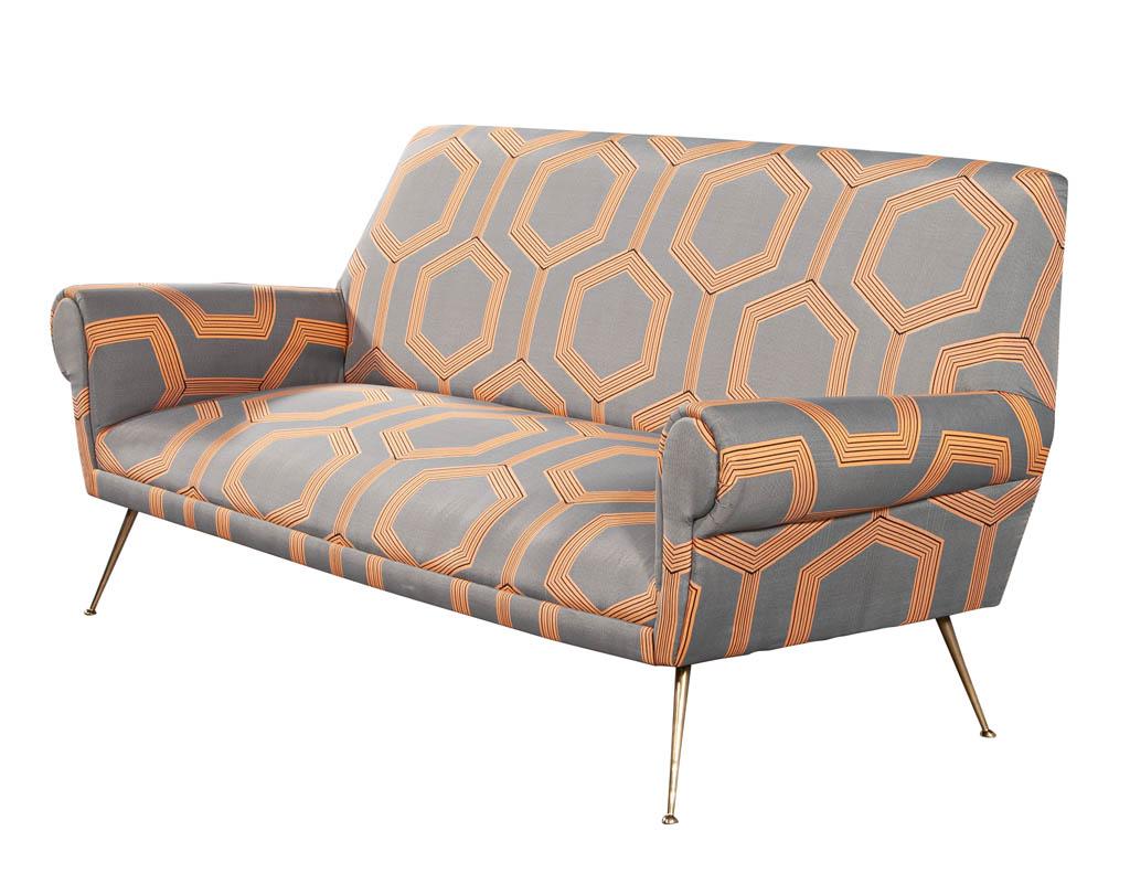 Italian Mid-Century Modern Sofa Settee. Upholstered in a modern geometric pattern with brass turned legs. All original from Italy, circa 1970’s.

Price includes complimentary curb side delivery to the continental USA.