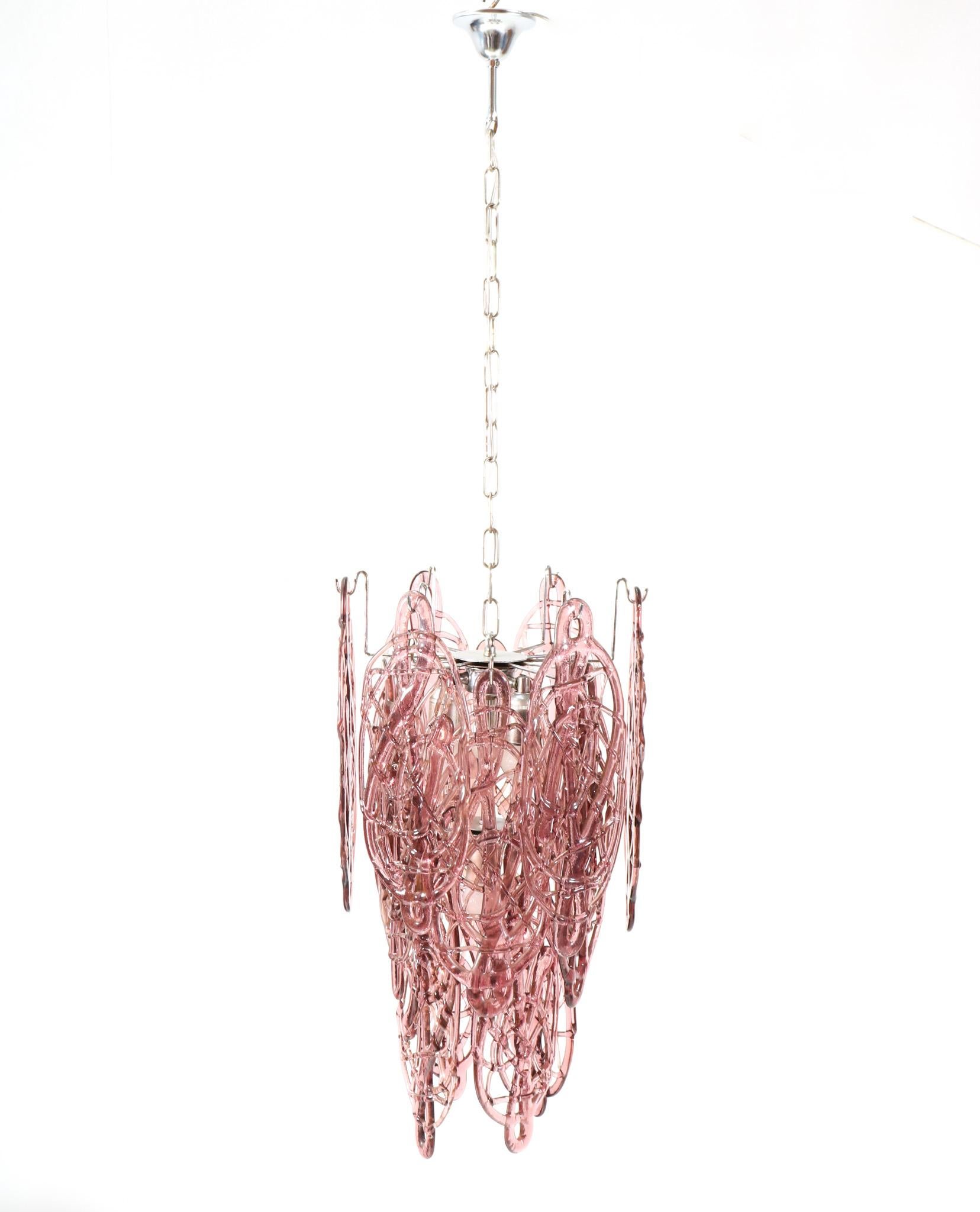 Magnificent and rare Mid-Century Modern Model Spider Web pendant lamp.
Design by Gino Vistosi for Vetrerie Mazzega Murano.
Striking Italian design from the 1960s.
Original chrome-plated steel frame with original hand-made cast purple glass