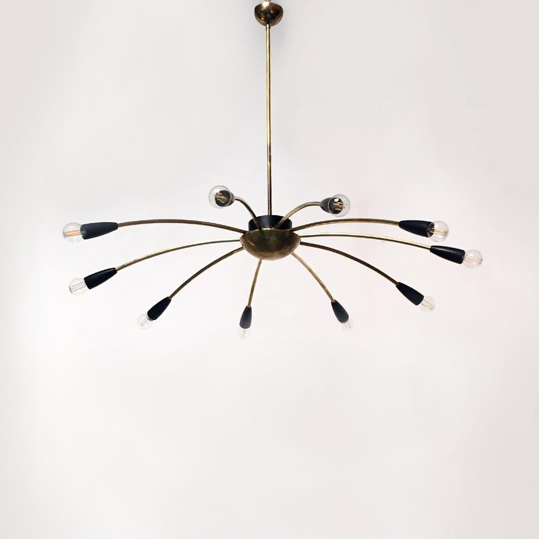 Italian Mid-Century Modern Sputnik brass ten lights chandelier, 1950s
Sputnik style ten lights chandelier, with brass structure with curved arms and black plastic parts.
1950s.

Plant replaced, perfect condition.

Measurements: 95 x 85 H cm.