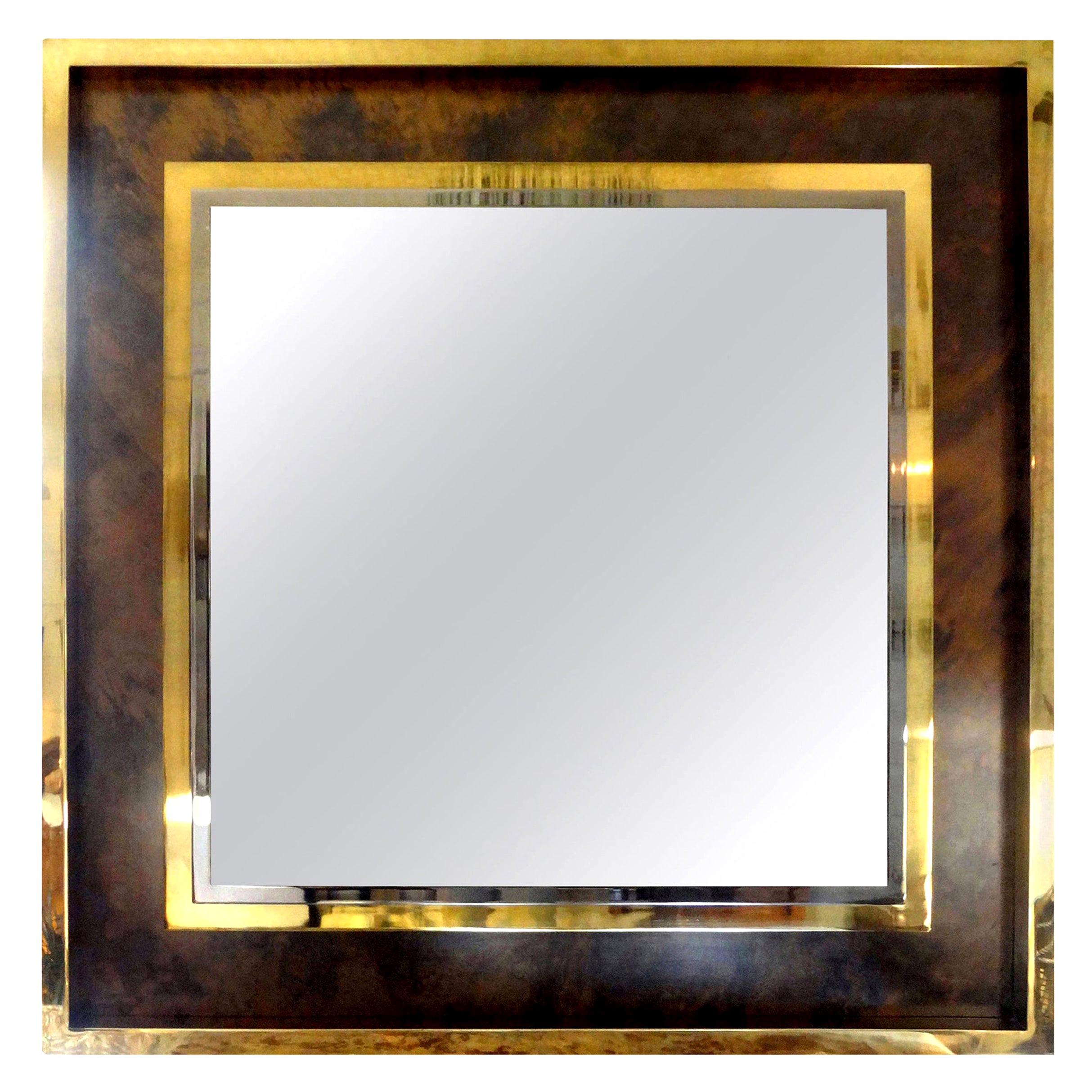 Magnificent Italian square brass or bronze Romeo Rega attributed with tortoiseshell pattern trimmed with an interior chrome border. This unusual Italian wall mirror has a most beautiful bronze central mirror and is very well made. This large mirror,