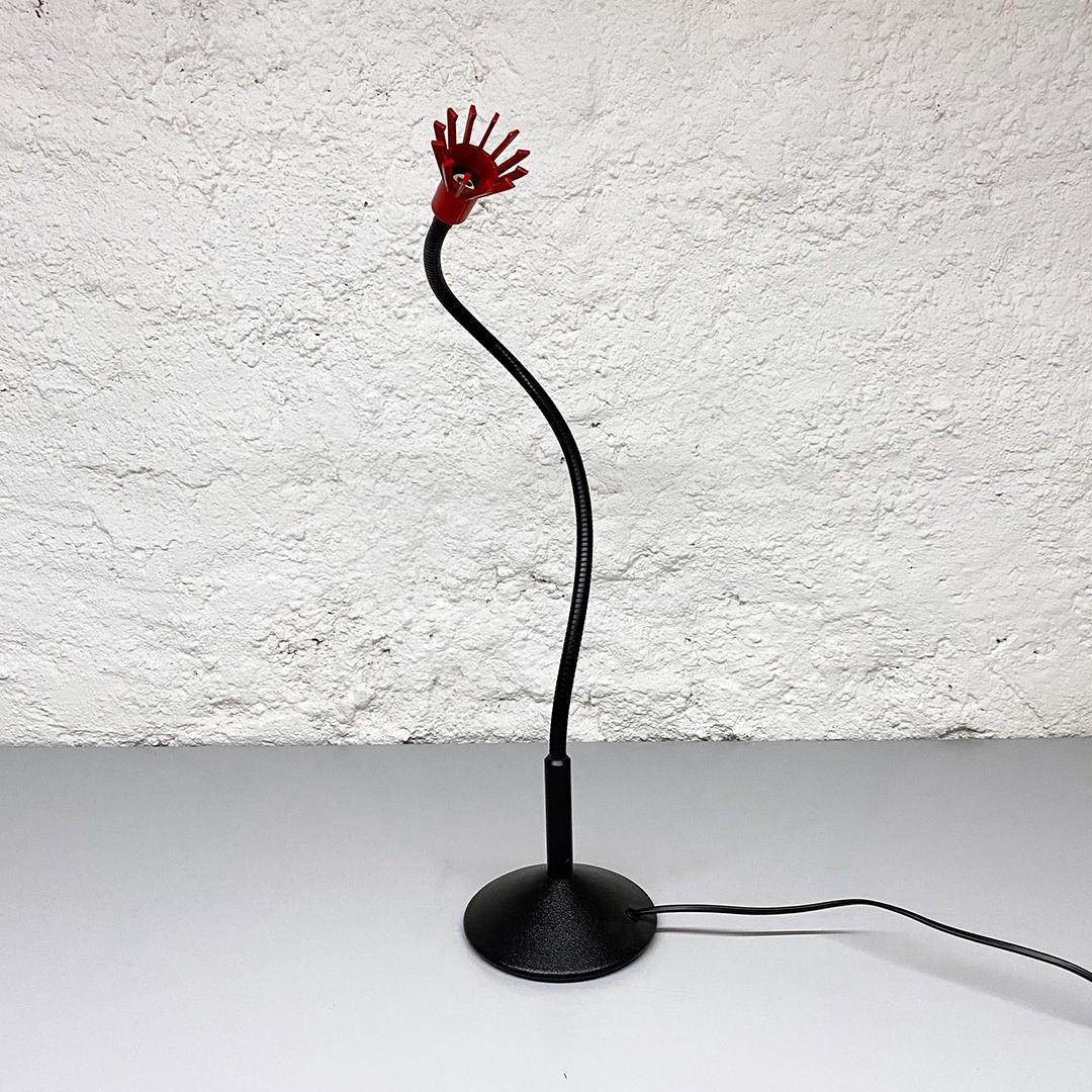 Italian Mid-Century Modern table lamp mod. Solitaire by Tronconi, 1970s 
Articulated table lamp, Solitaire model, with black metal structure with flexible arm and red metal lampshade.

Produced by Tronconi Illuminazione, out of production from more