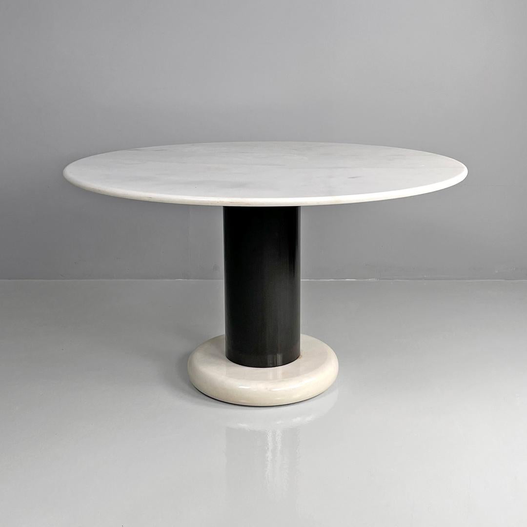 Italian mid-century modern table Loto Rosso by Ettore Sottsass Poltronova, 1965
Round dining table mod. Loto Rosso. The round top and base are in white Carrara marble, with rounded shaped profiles. The central stem is a black painted metal