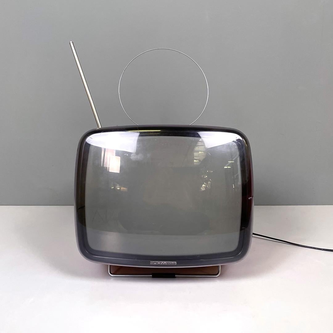 Italian mid-century modern orange and black television Doney by Brionvega, 1962
Squared television mod. Doney in orange and black plastic, with metal details on the profile. On the top it has a pull-out handle, two antennas and black plastic