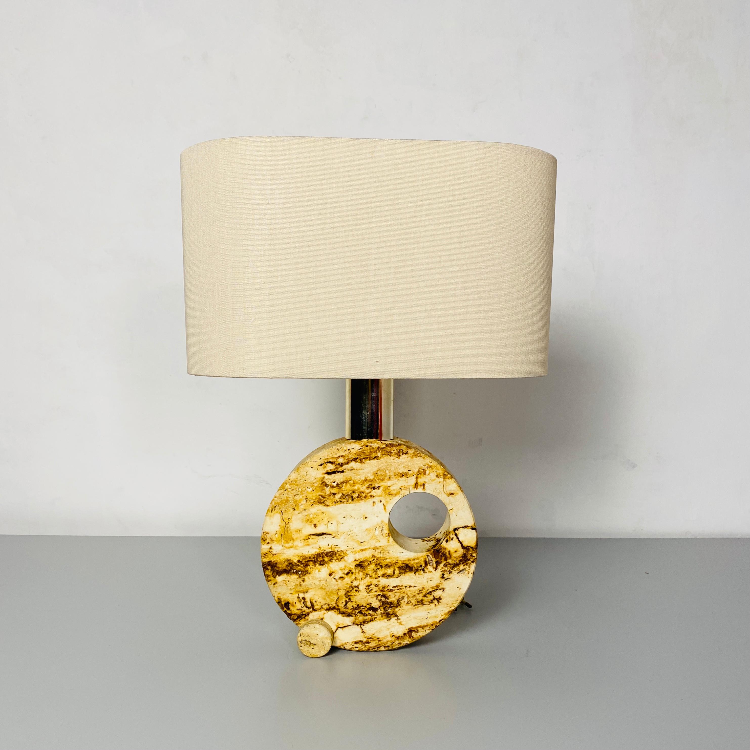 Italian Mid-Century Modern travertine table lamp with cotton lampshade, 1970s
Table lamp with circular base in perforated travertine, steel lamp holder and new cotton lampshade.
The base is in the Fratelli Mannelli style.

Measures: 31x17x43h cm.