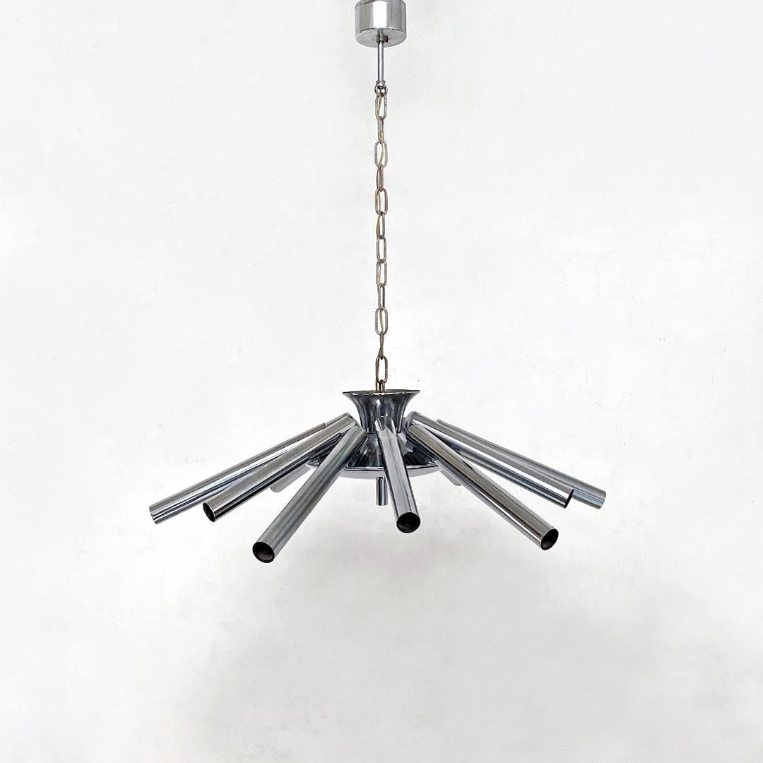 Italian Mid-Century Modern twelve-light chromed steel chandelier, 1970
Twelve-light chandelier with chromed steel bracelets and original period chain stem.

Perfect conditions.

Measurements 74 x 87 H cm.