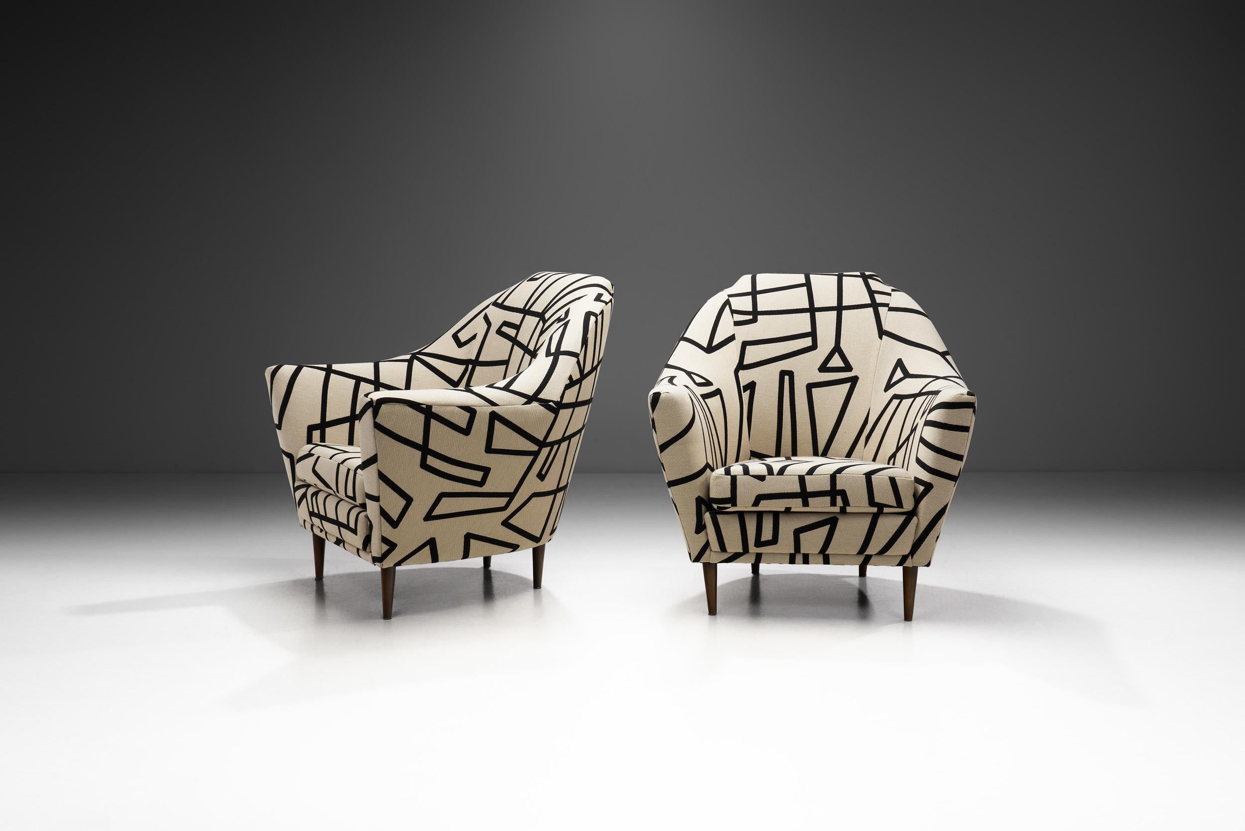 These individualistic chairs possess a playful and stylish look that Italian Modern furniture is beloved and coveted for. Defined by the stylish silhouette of the design covered in a characteristic, geometric patterned fabric, perfect execution, and