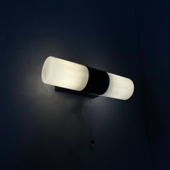 Italian mid-century modern wall lamp in opaline glass and black Bakelite, 1950s