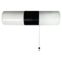 Italian mid-century modern wall lamp in opaline glass and black Bakelite, 1950s