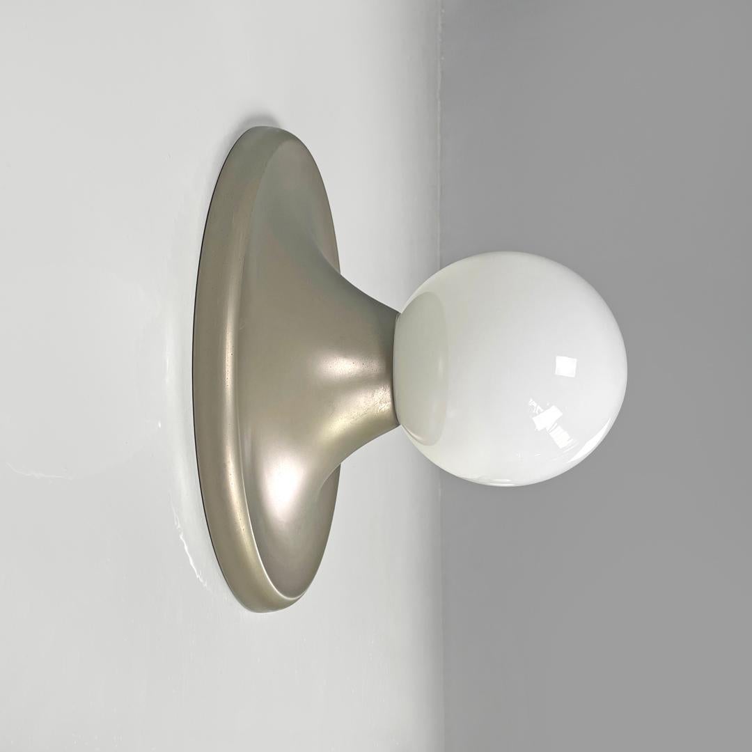 Italian mid-century modern matte metal wall lamp Light Ball by Achille and Pier Giacomo Castiglioni  for Flos, 1960s
Wall or ceiling lamp model Light Ball with spherical diffuser in opaline glass. The round-based structure is matte metal.
Produced