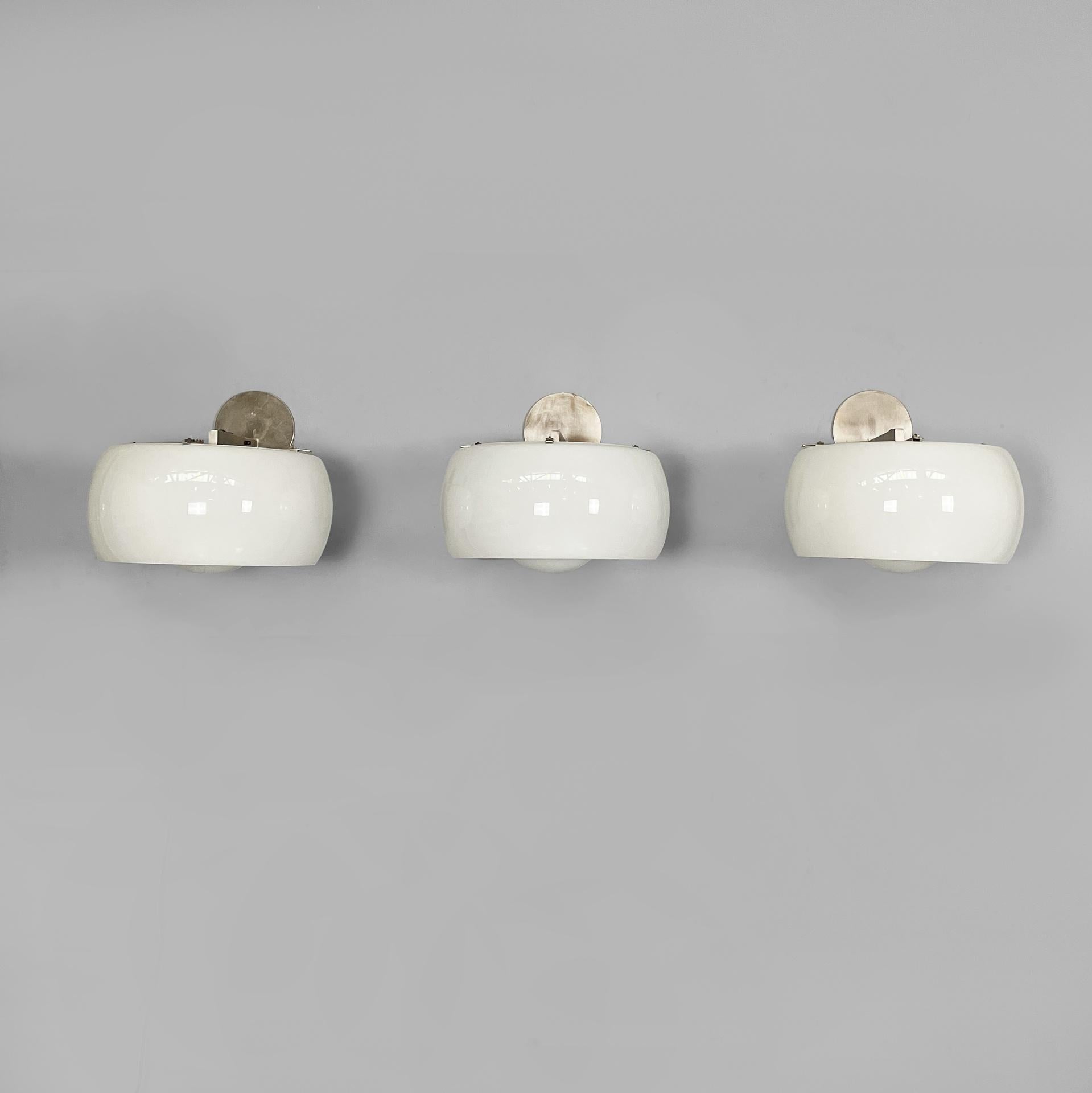 Italian mid-century modern wall lamps Omega by Vico Magistretti for Artemide, 1970s
Set of three iconic and fantastic wall lamps model Omega with a cylindrical diffuser and an internal sphere, made of opaline glass. The bulb is positioned inside the