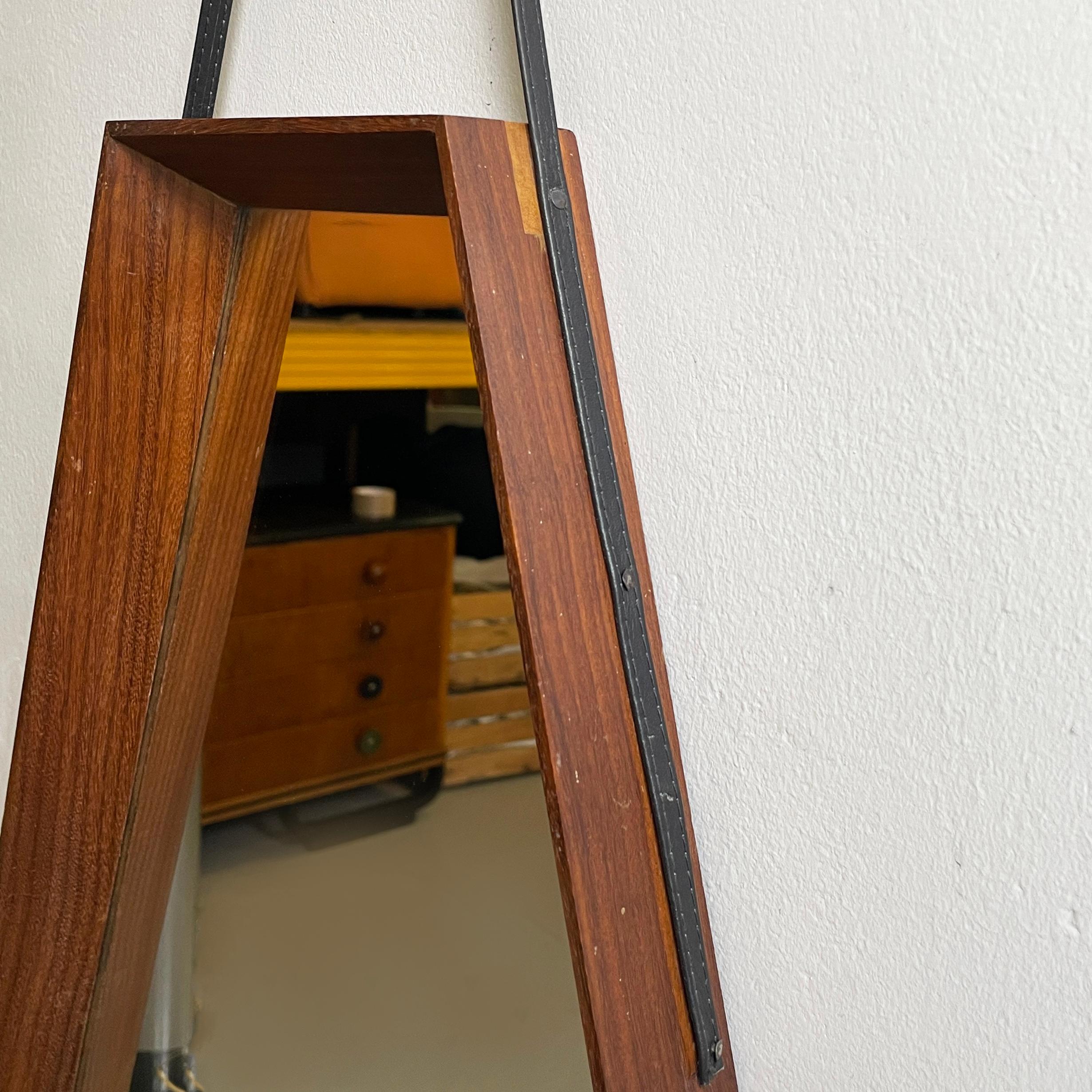 Italian mid-century modern Wall mirror in wood and black leather, 1960s For Sale 1