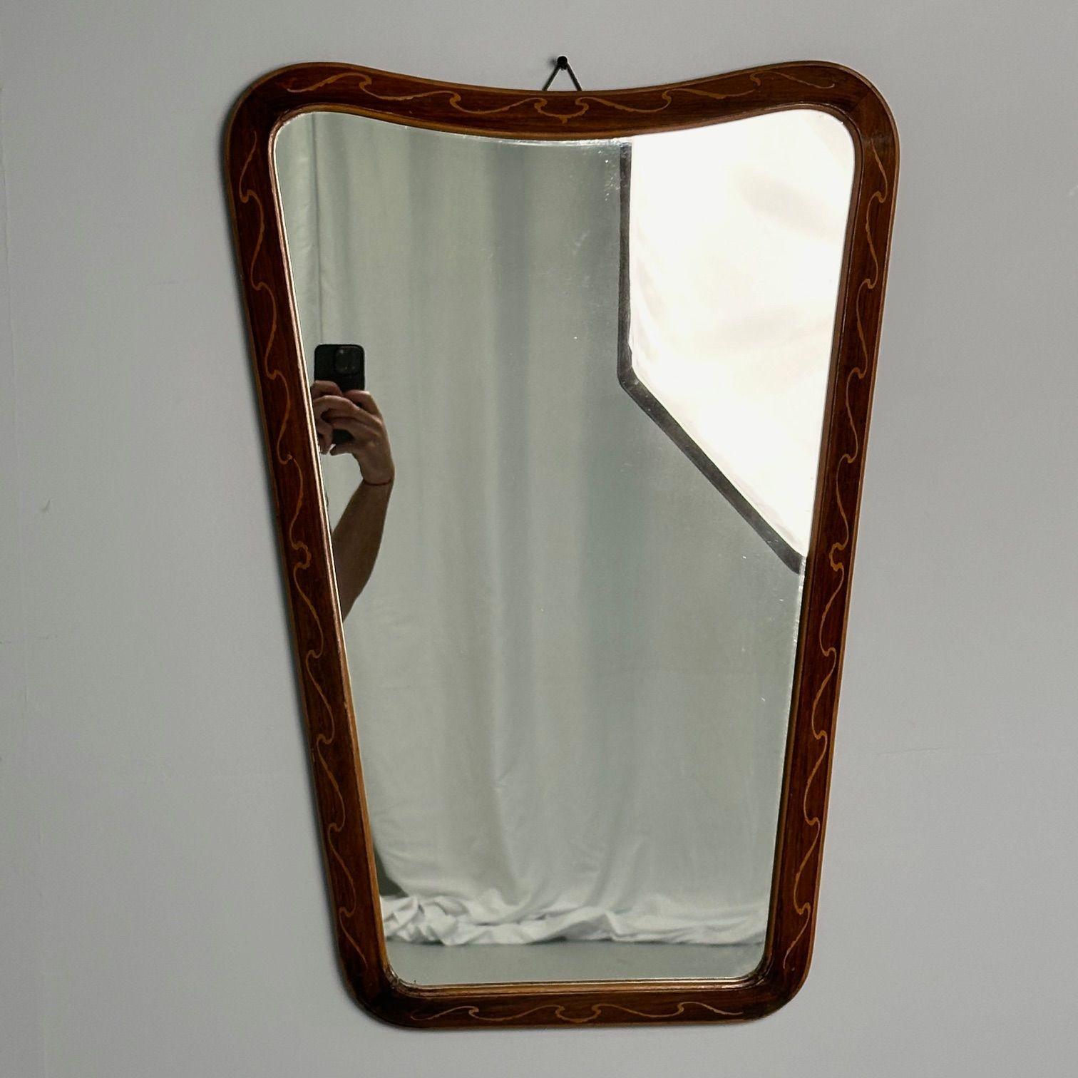 Italian Mid-Century Modern, Wall Mirror, Inlaid Walnut, Italy, 1970s

Modernist mirror designed and produced in Italy circa 1970s. This example has an organic modern trapezoidal form and features an inlaid wooden frame.

Height: 29 inches, Width: 20