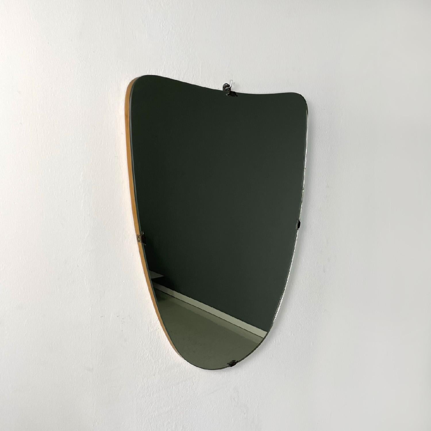 Mid-Century Modern Italian mid-century modern wall mirror rounded shield shape brass details, 1960s