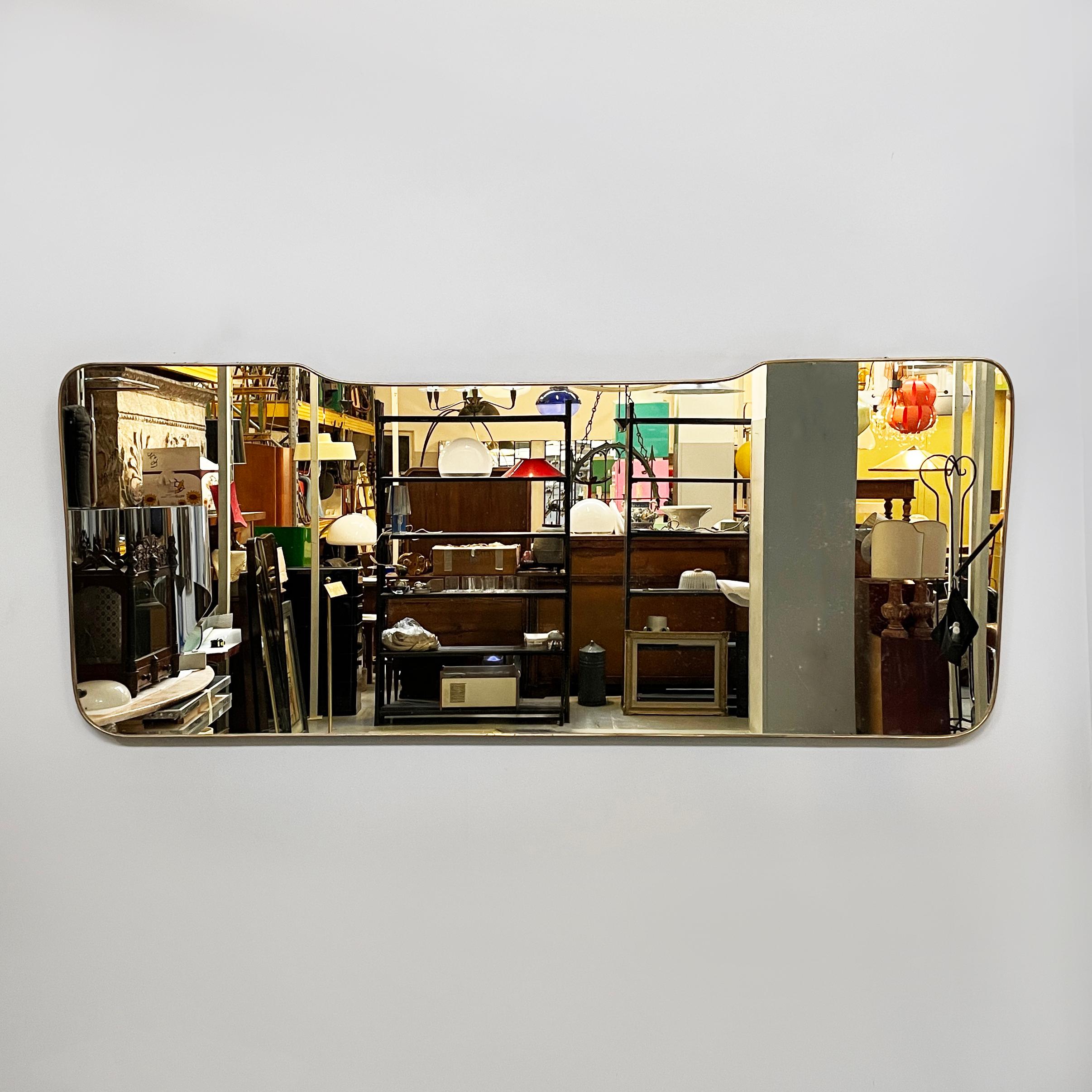 Italian mid-century modern wall mirror with brass, 1950s
Vintage and shaped wall mirror with rounded corners and brass frame. The large mirror has two hooks for wall mounting.
it came from 1950s
Fair condition. It has two defects and small scattered