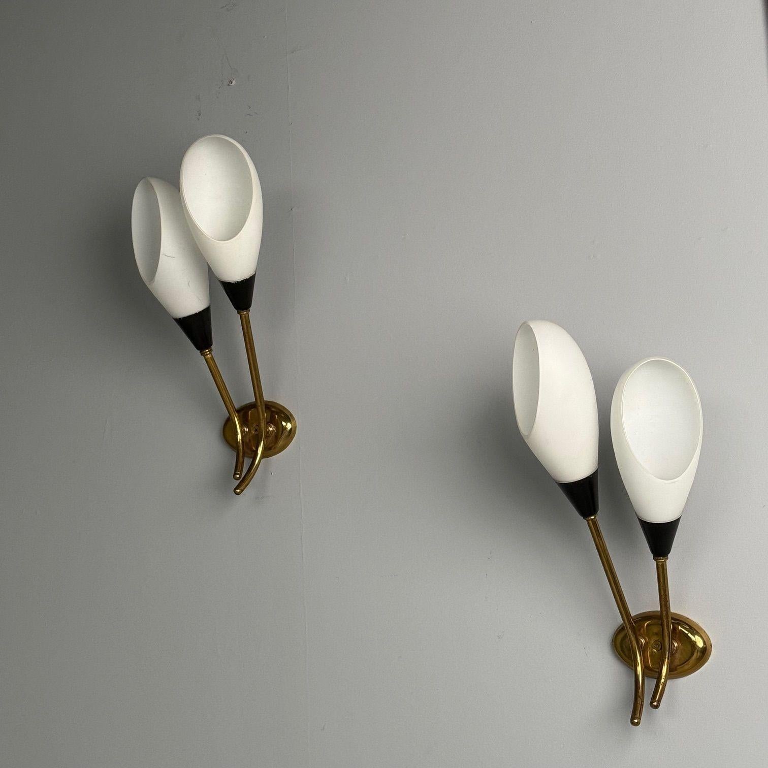 Italian Mid-Century Modern, Wall Sconces or Wall Lights, Patinated Brass, Opaline Glass, Italy, 1950s

These mid-century modern wall sconces are a stunning representation of Italian design from the mid-20th century. With their patinated brass and