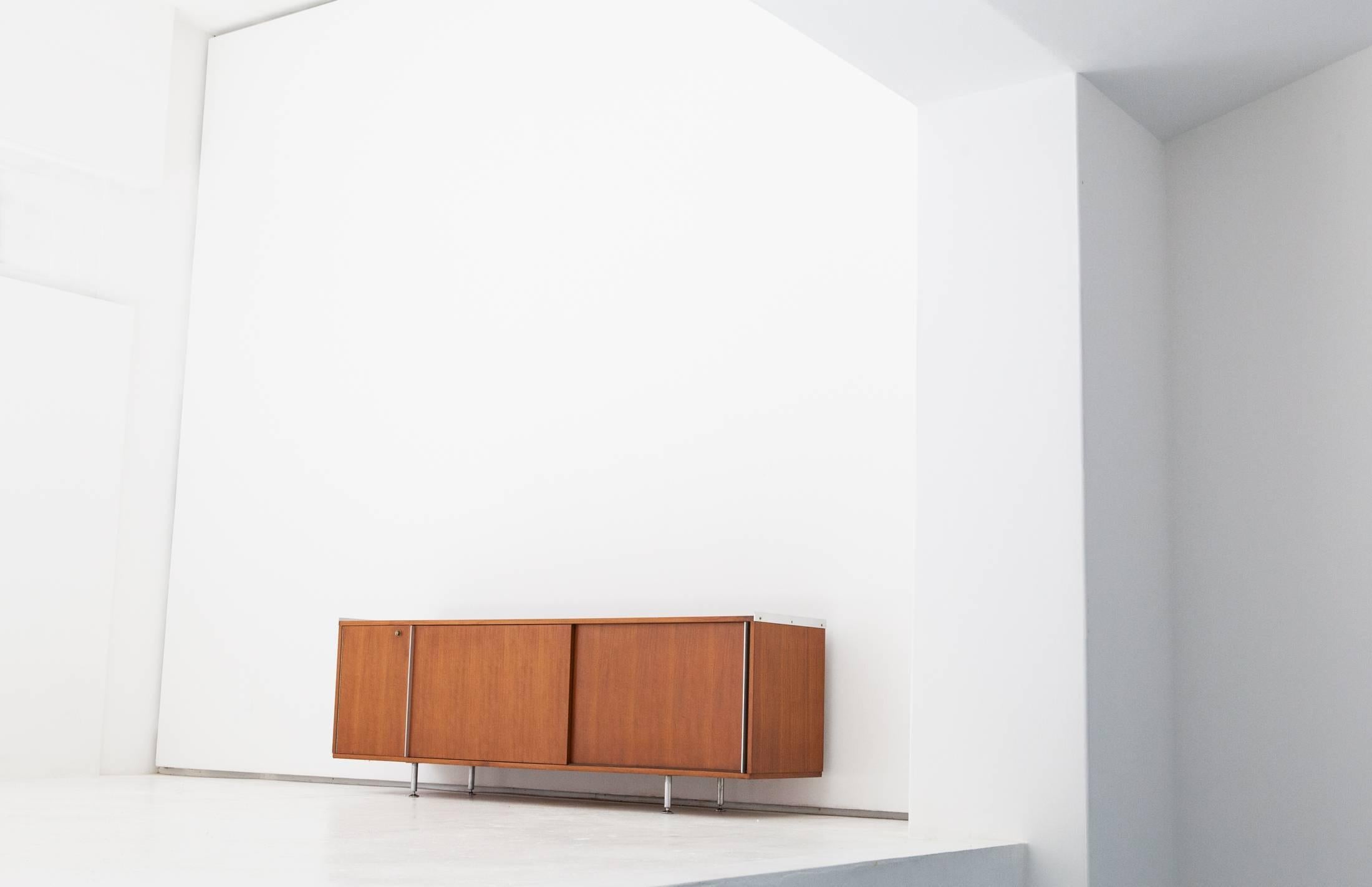 Modern credenza with sliding doors by Alberto Roselli for Gio Ponti ,  produced in Italy in 1950's .
Walnut wood with aluminium parts , internal shelves adjustable in height.
Mid-Century Modern style item



 