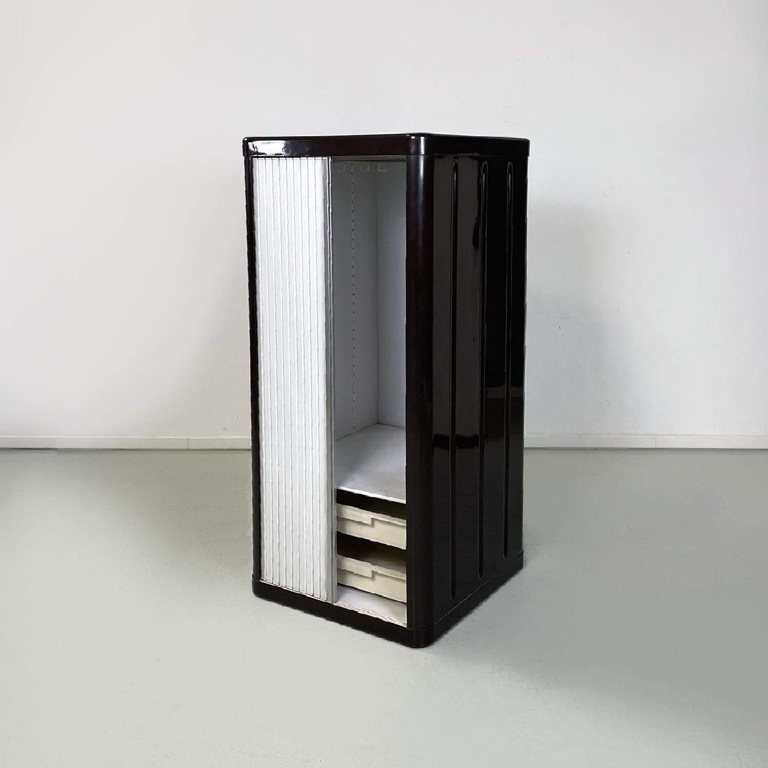 Italian mid-century modern wardrobe Pierluigi Molinari Asnaghi Box System, 1969
Square base cabinet. The structure is in ABS and fiberglass and is brown-purple in color, while the interior is white. It has a white plastic retractable sliding shutter