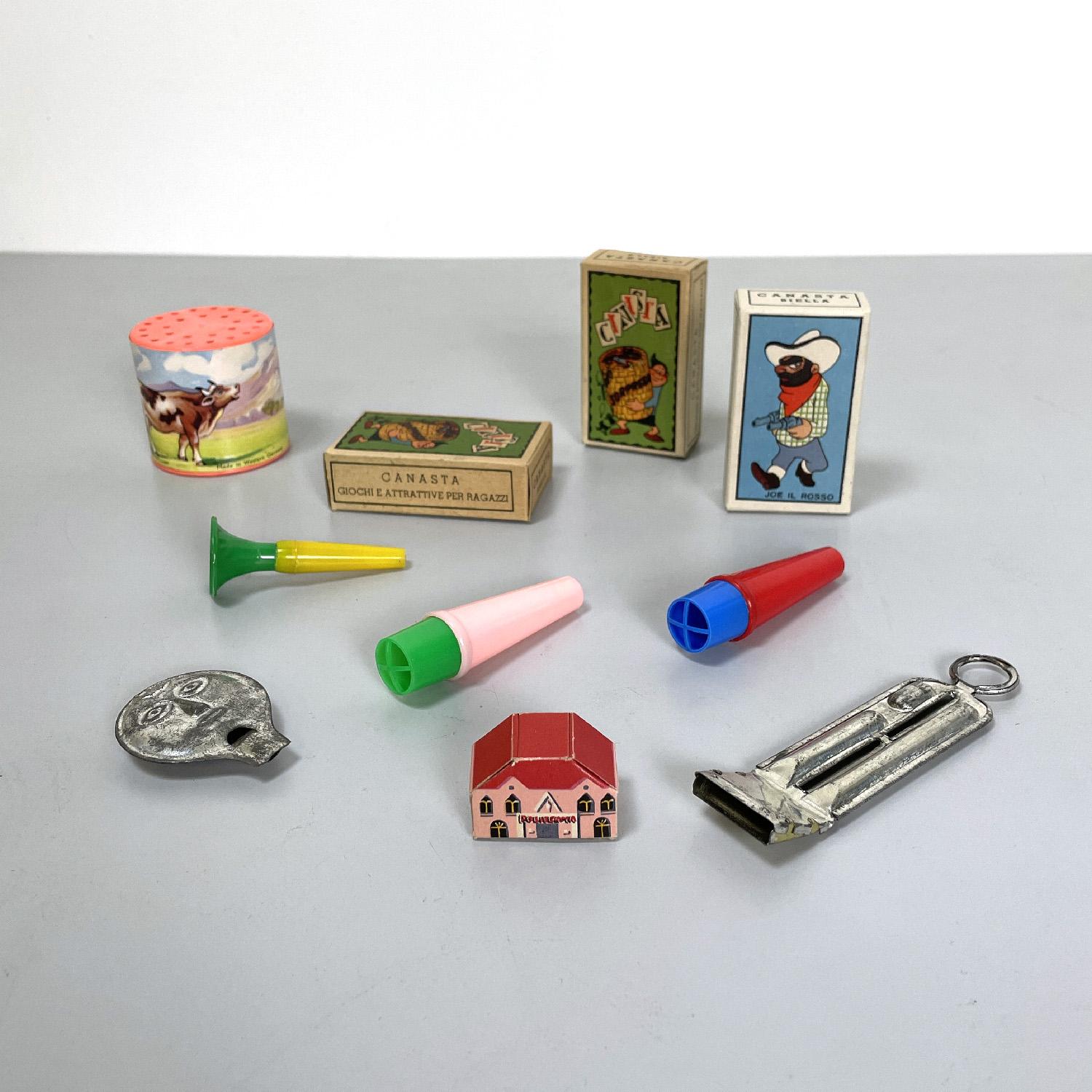 Italian mid-century modern whistles and musical games, 1960s
Music game set. There are three whistles in yellow, green, red and blue colored plastic; three small cardboard boxes with colored prints of some characters, two metal whistles, one of