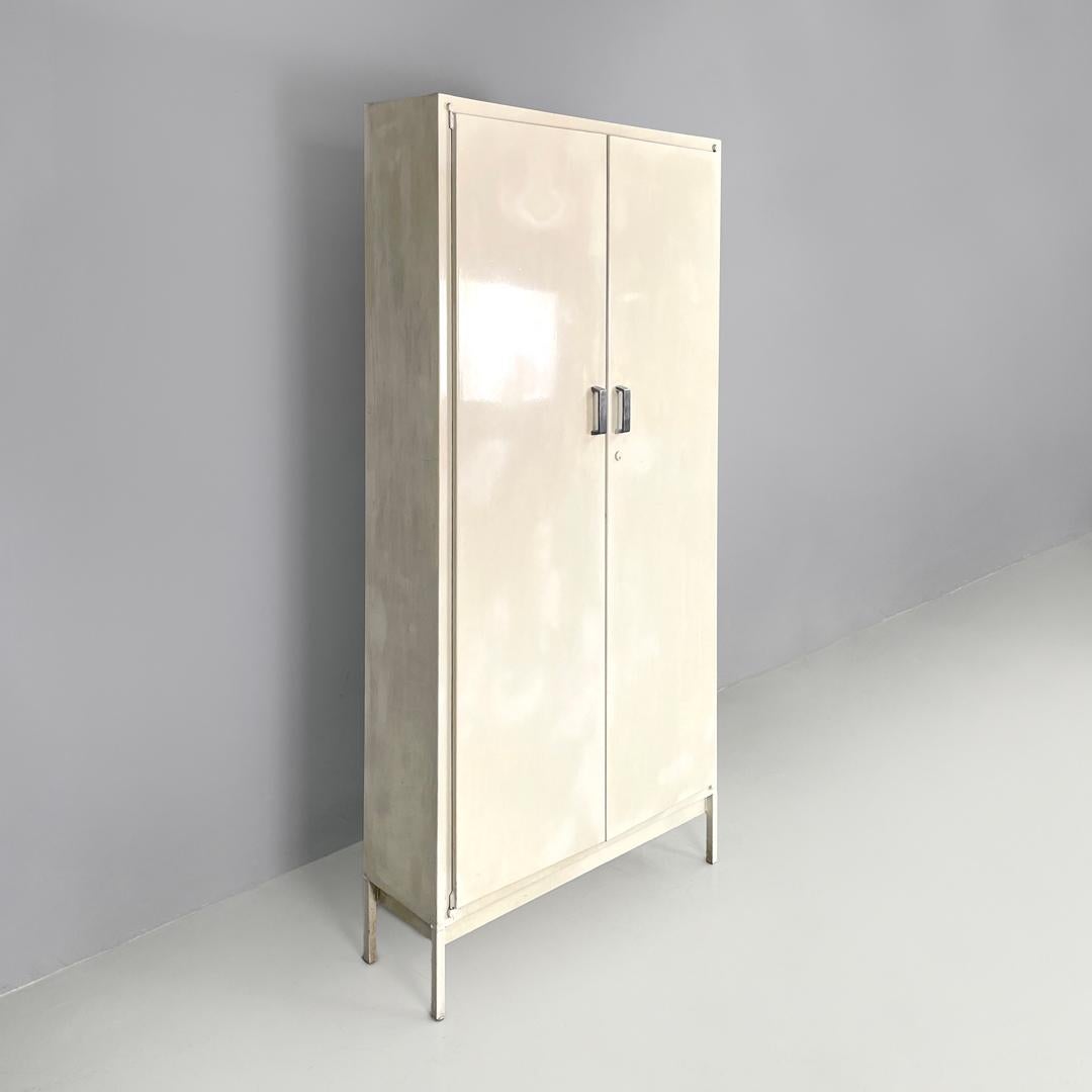 Italian mid-century modern white industrial bathroom two doors cabinet, 1960s In Fair Condition For Sale In MIlano, IT