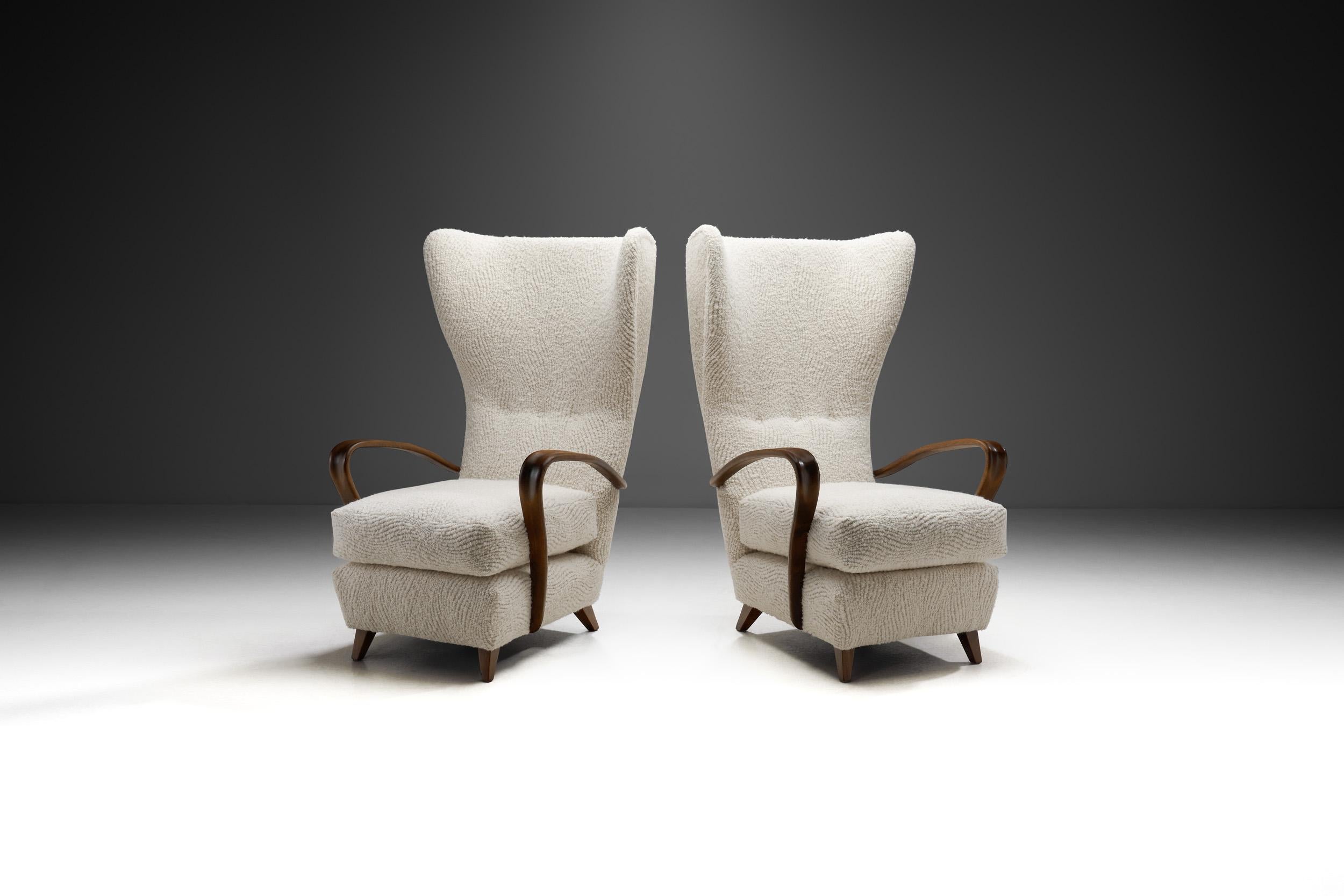 These mid-century modern Italian high-back chairs are exquisite examples of the timeless elegance that defines the era’s design in Italy. Crafted during the peak of the movement, these chairs are a testament to the era's commitment to sleek lines,