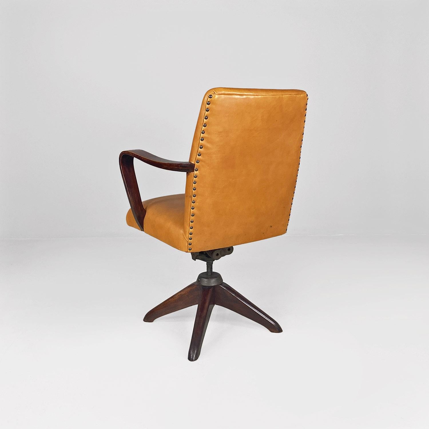 Metal Italian mid-century modern wood and brown leather swivel office armchair, 1960s