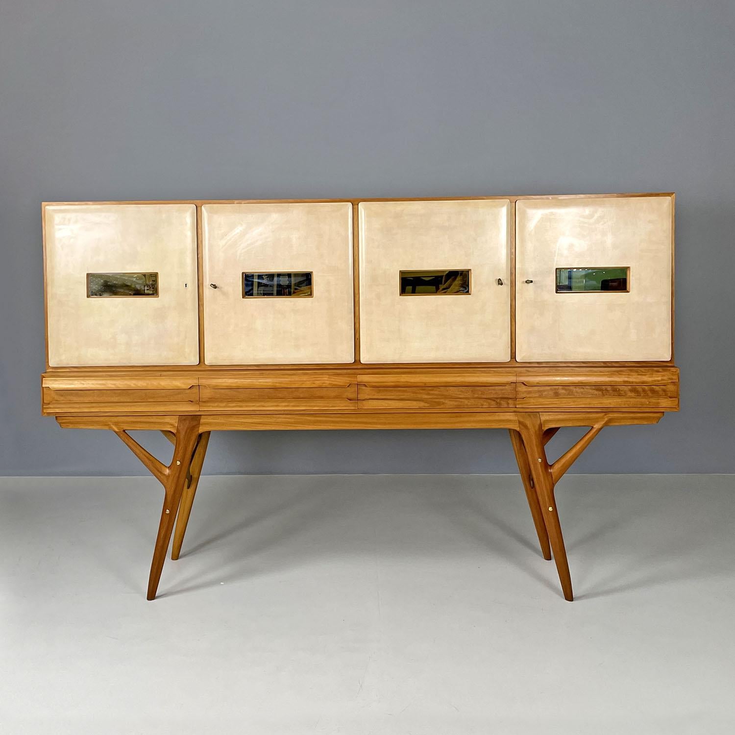 Italian mid-century modern wood and parchment highboard Palazzi dell'Arte, 1950s
High sideboard or highboard with bar compartment. The upper part is made up of four compartments with doors covered in parchment, each door has a recess with a