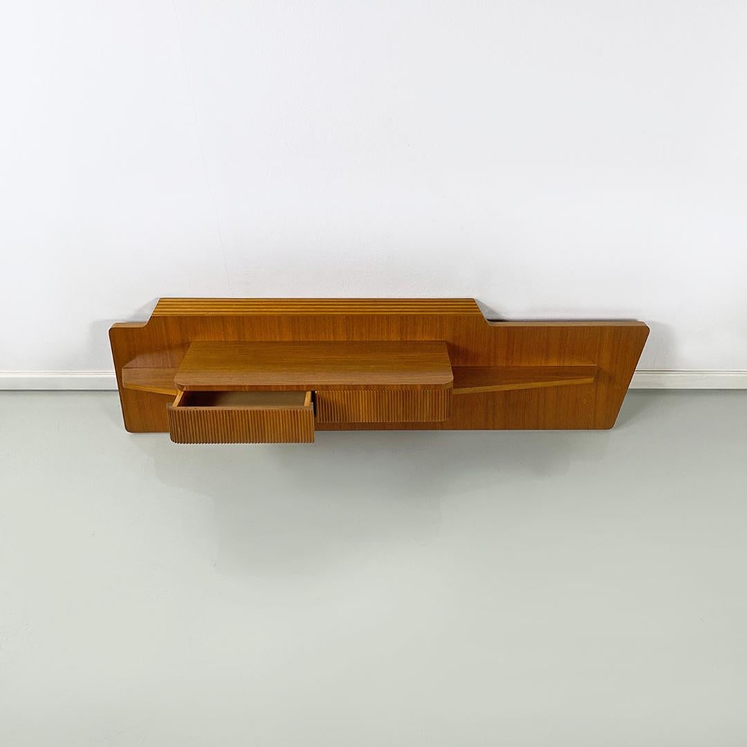 Italian Mid-Century Modern wood irregular shape entrance console with drawer, 1960s.
Entrance console in shaped wood, with irregular shape with double drawer and grissinato front. Support surface that can also be used as a small desk.
1960s