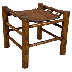 Italian mid-century modern wood stool and brown leather seat with straps, 1950s