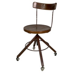 Italian mid-century modern wooden and metal chair with casters, 1940s
