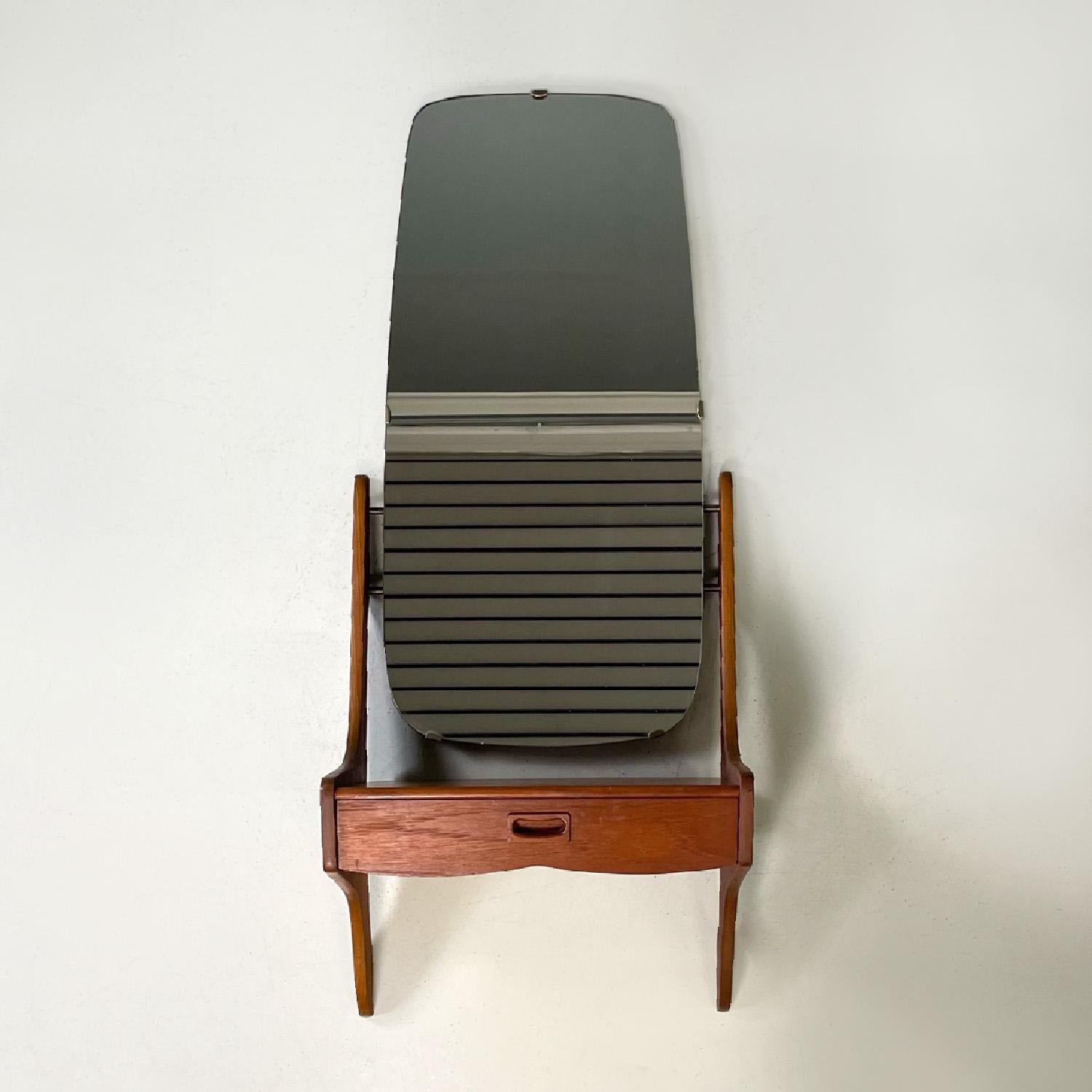 Italian mid-century modern wooden wall round mirror with shelf and drawer, 1960s
Wooden wall console table with mirror. Composed of a rounded mirror and a shelf with drawer. The underside is set slightly forward from the wall. It can be used as a