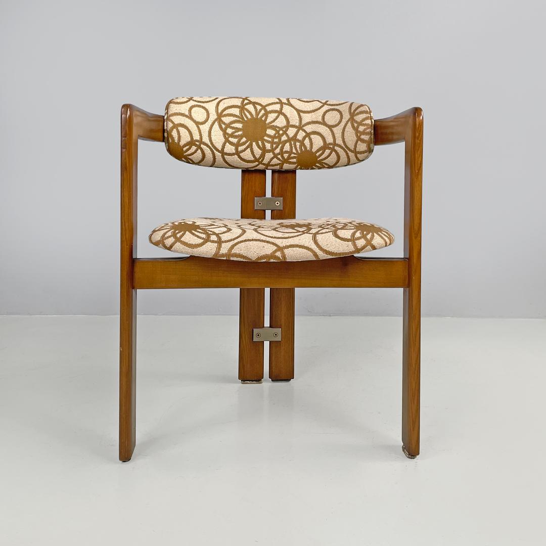 Italian mid-century modern wooden fabric chair Pamplona by Savini for Pozzi 1965
Tub chair in wood and fabric. The structure curves at the top to form the backrest and armrests. The four legs with a rectangular section are two at the front on the