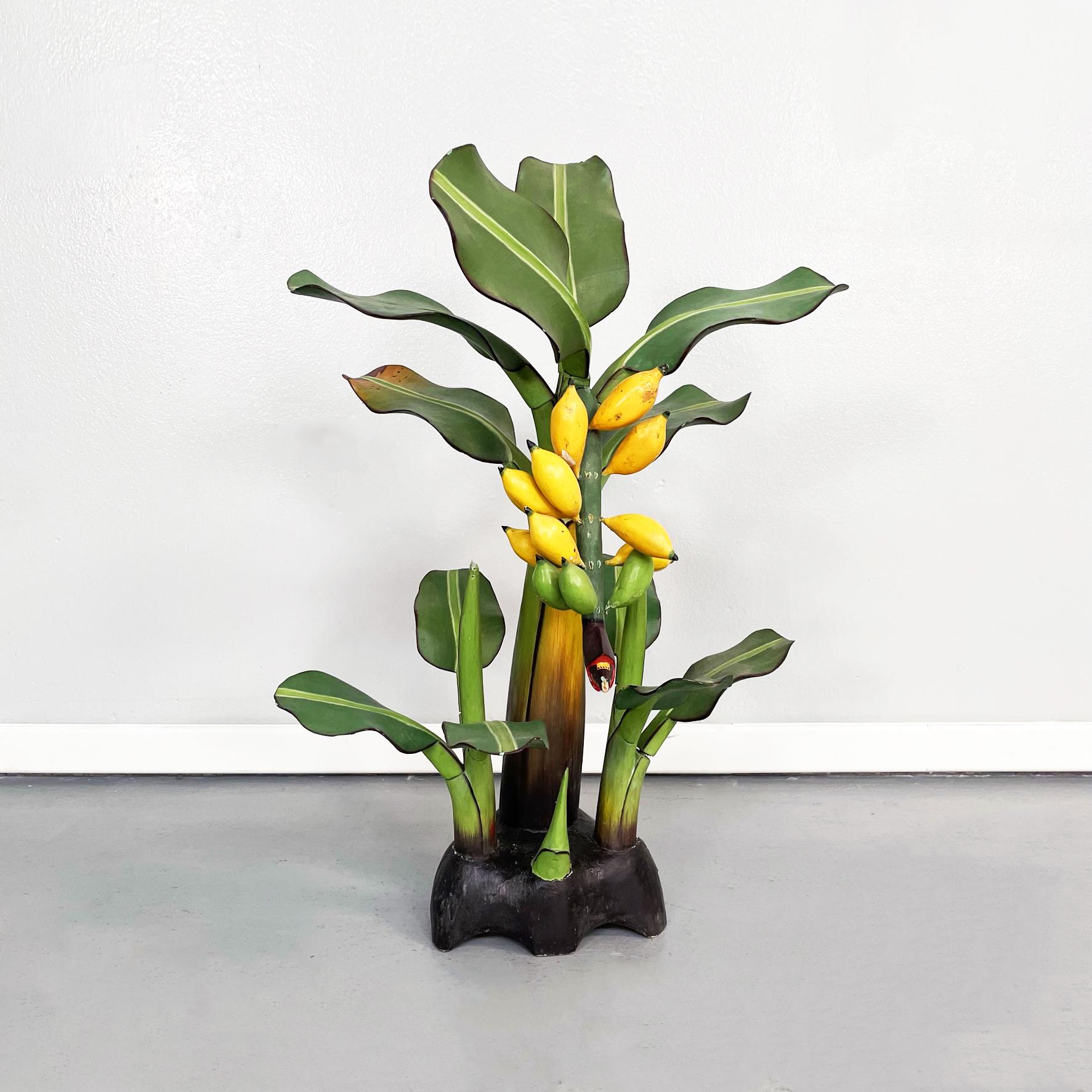 Italian Mid-Century Modern Wooden sculpture of a banana plant, 1950s
Sculpture of a banana plant in carved wood with interlocking leaves. Hand crafted and painted.
1950s.
Good conditions. In some places the color is missing. Two leaves are