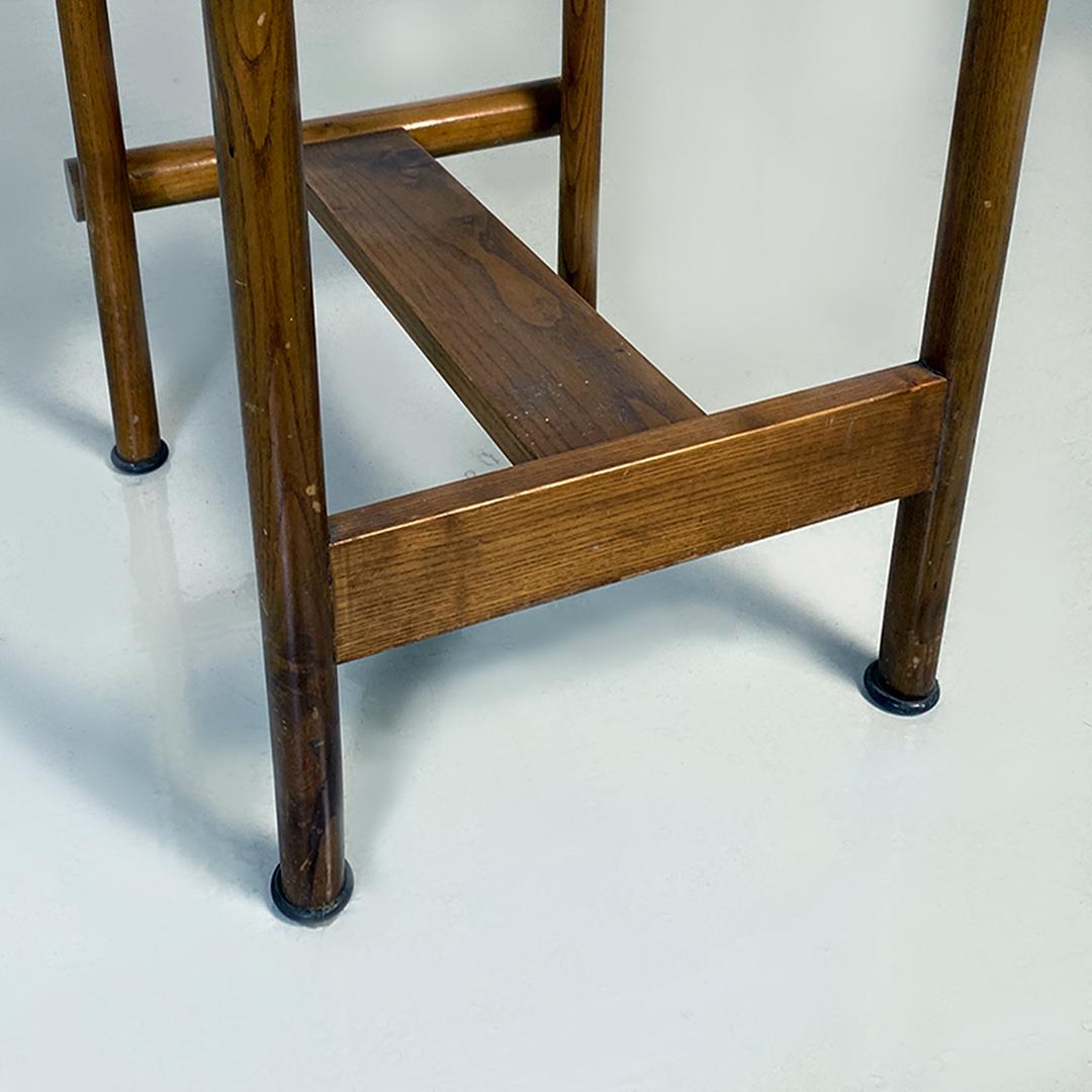 Italian mid century modern wooden structure and faux leather seat high stool, 1970s
Stool with wooden structure with round section legs and footrest, round seat covered in dark brown sky and curved backrest.
1970s
Good general