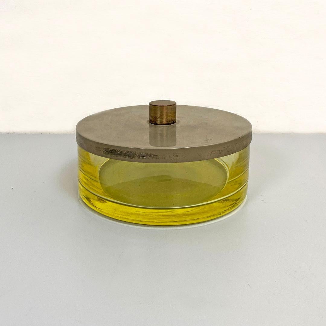 Italian Mid-Century Modern yellow Murano glass containment centerpiece, 1970s
Centerpiece or container in yellow Murano glass with steel lid, round shape.
SP mark present on steel.
About 1970s
Good condition, small chip present on the perimeter