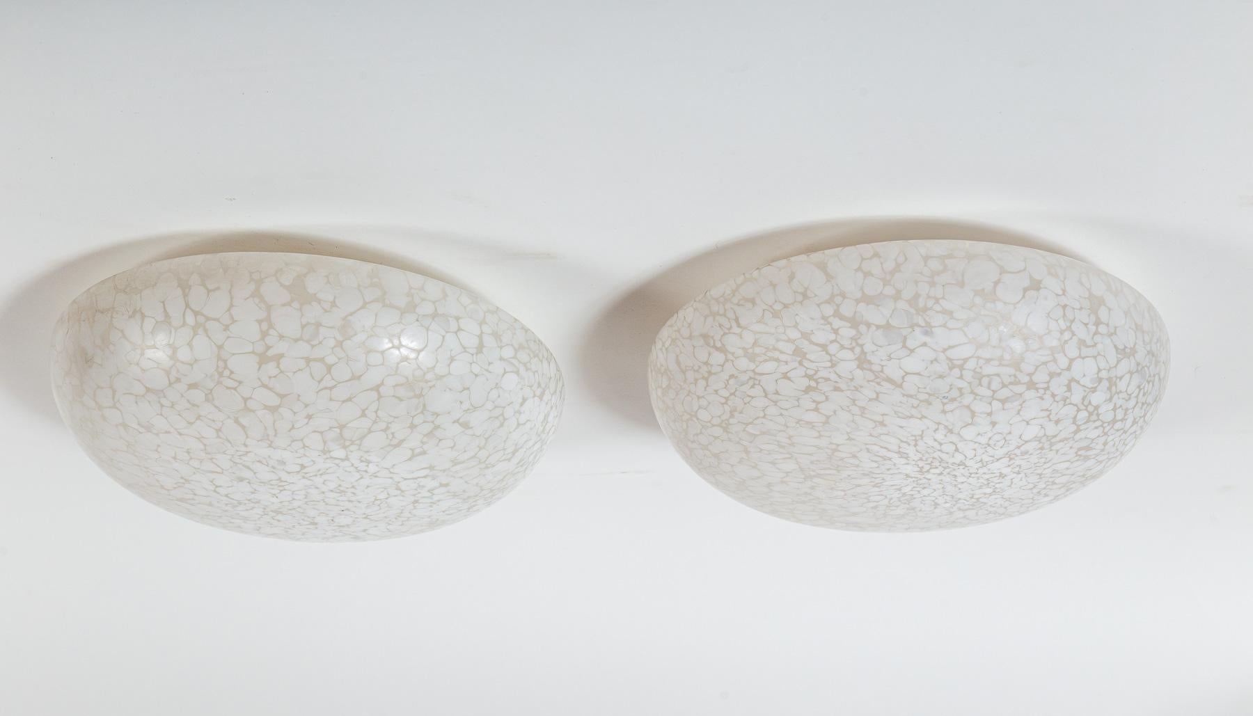 A beautiful set of hand made and blown Murano glass flush mount ceiling fixtures with a rare effect of 