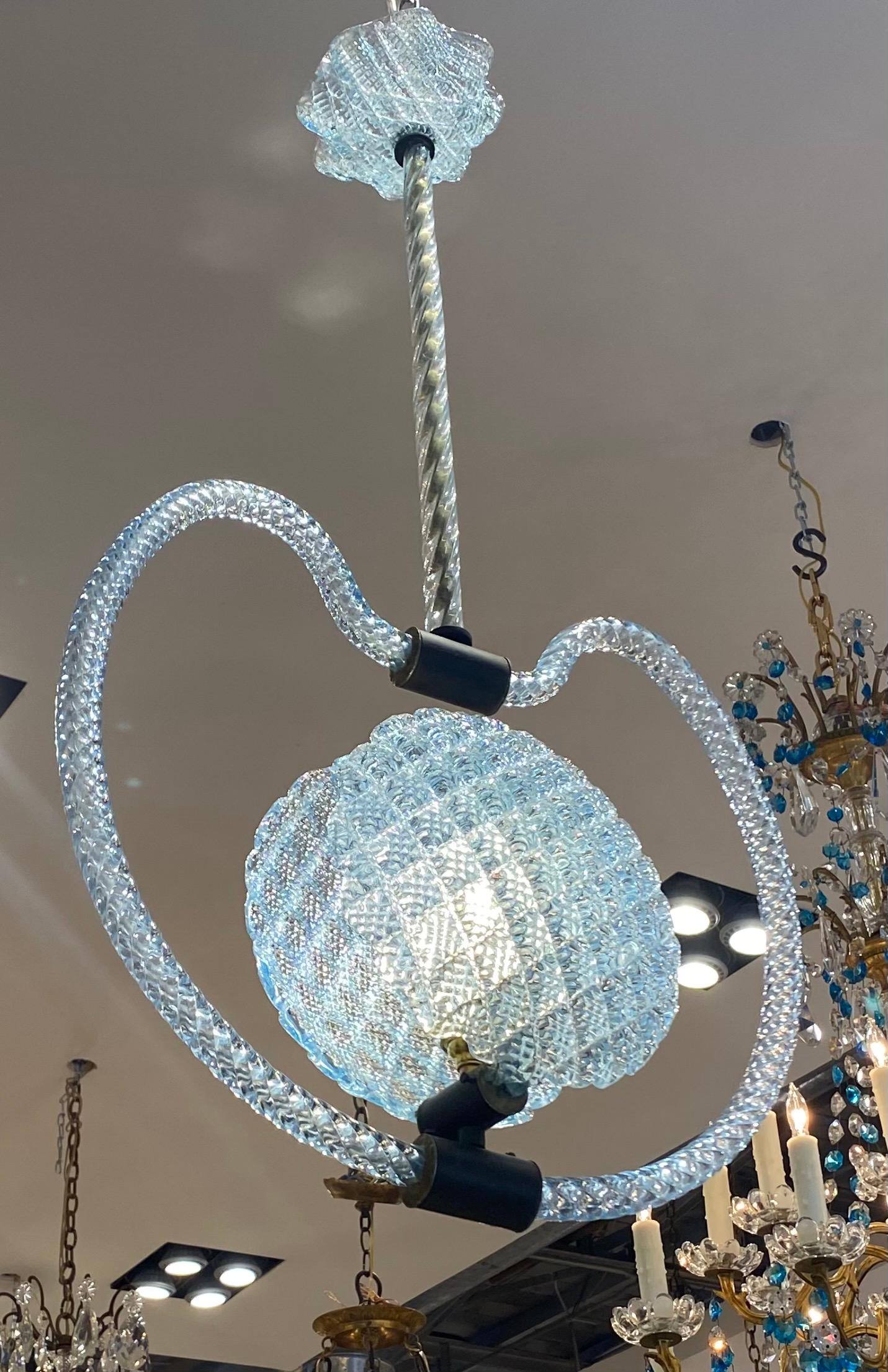 Italian Murano art glass chandelier, in the style of Barovier & Toso, c.1940s-1950s, blue glass, having scalloped ceiling mount falling to rope twist standard and moon shaped frame, centering two hatch cut and pattern pressed disk shades, concealing