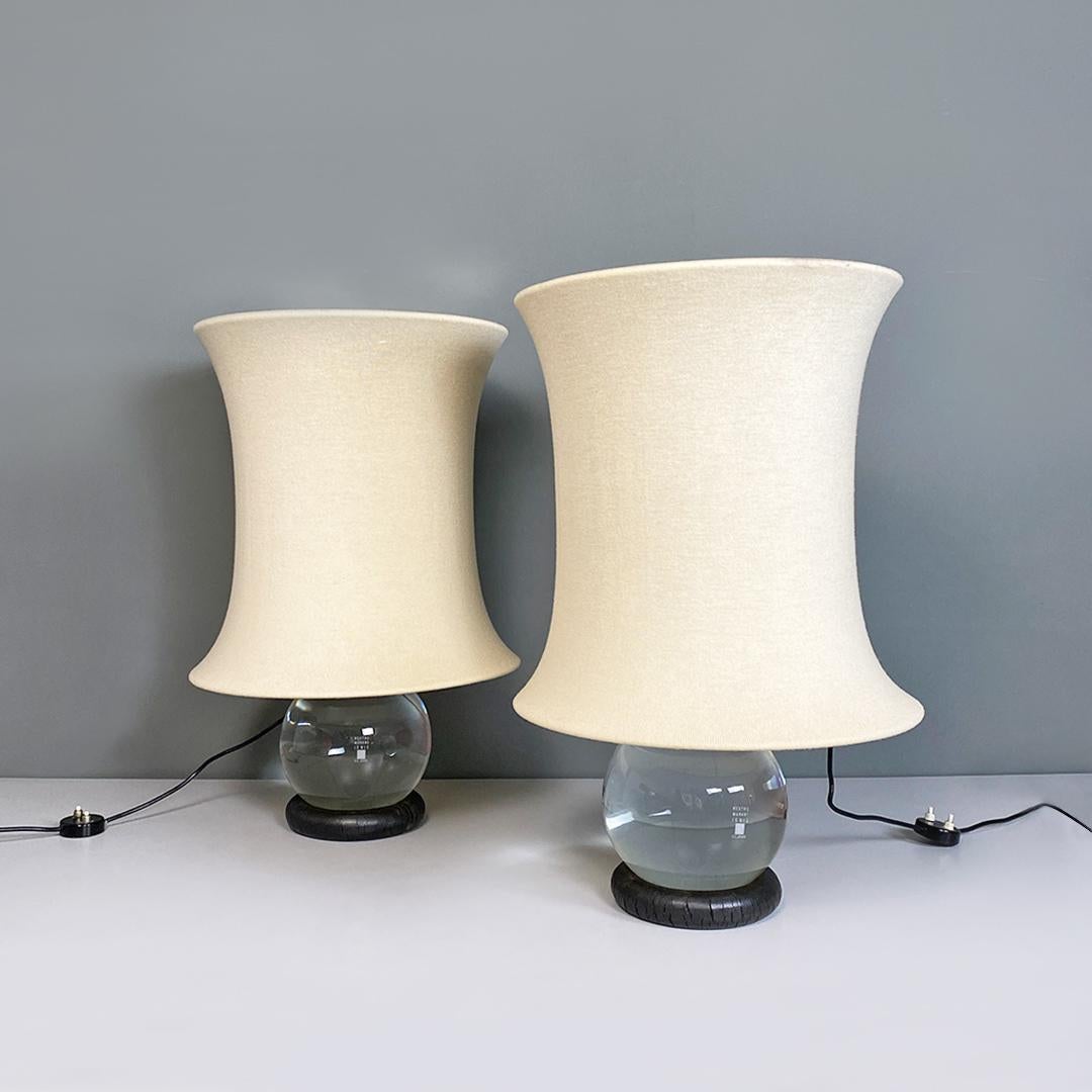 Italian Mid-Century Modern Murano glass and fabric Lotus table lamps by Gianfranco Frattini for Pino Meroni, 1964.
Lotus model table lamps or lampshades, with base with rubber ring on which a Murano glass ampoule is placed which, once filled with