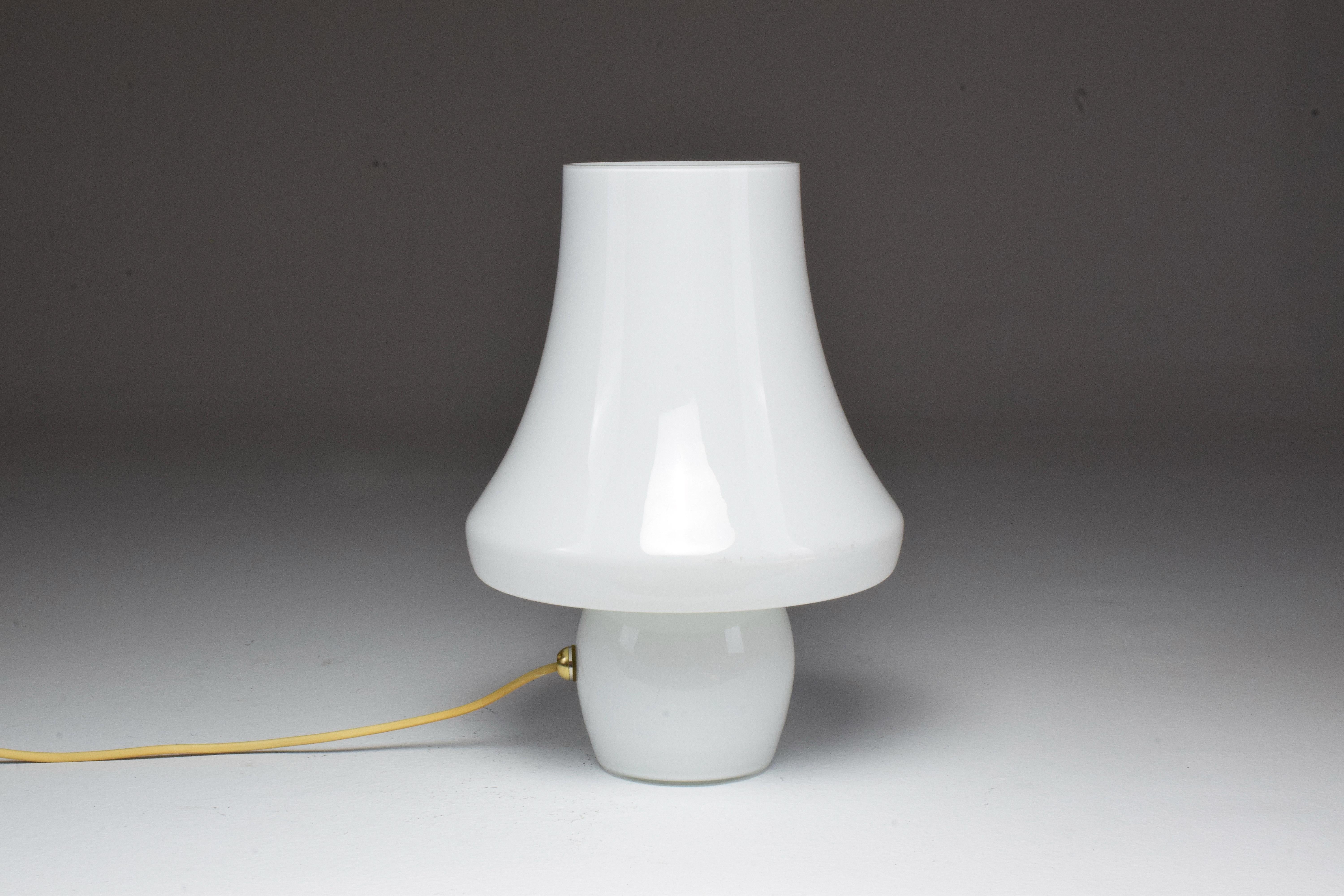 A rare 20th-century vintage table lamp designed by Carlo Nason in the 1960s and composed of Seguso and Venini Murano white glass.
Italy, circa 1960s.

This piece is professionally re-wired with the highest standards and universally compatible. 
E27