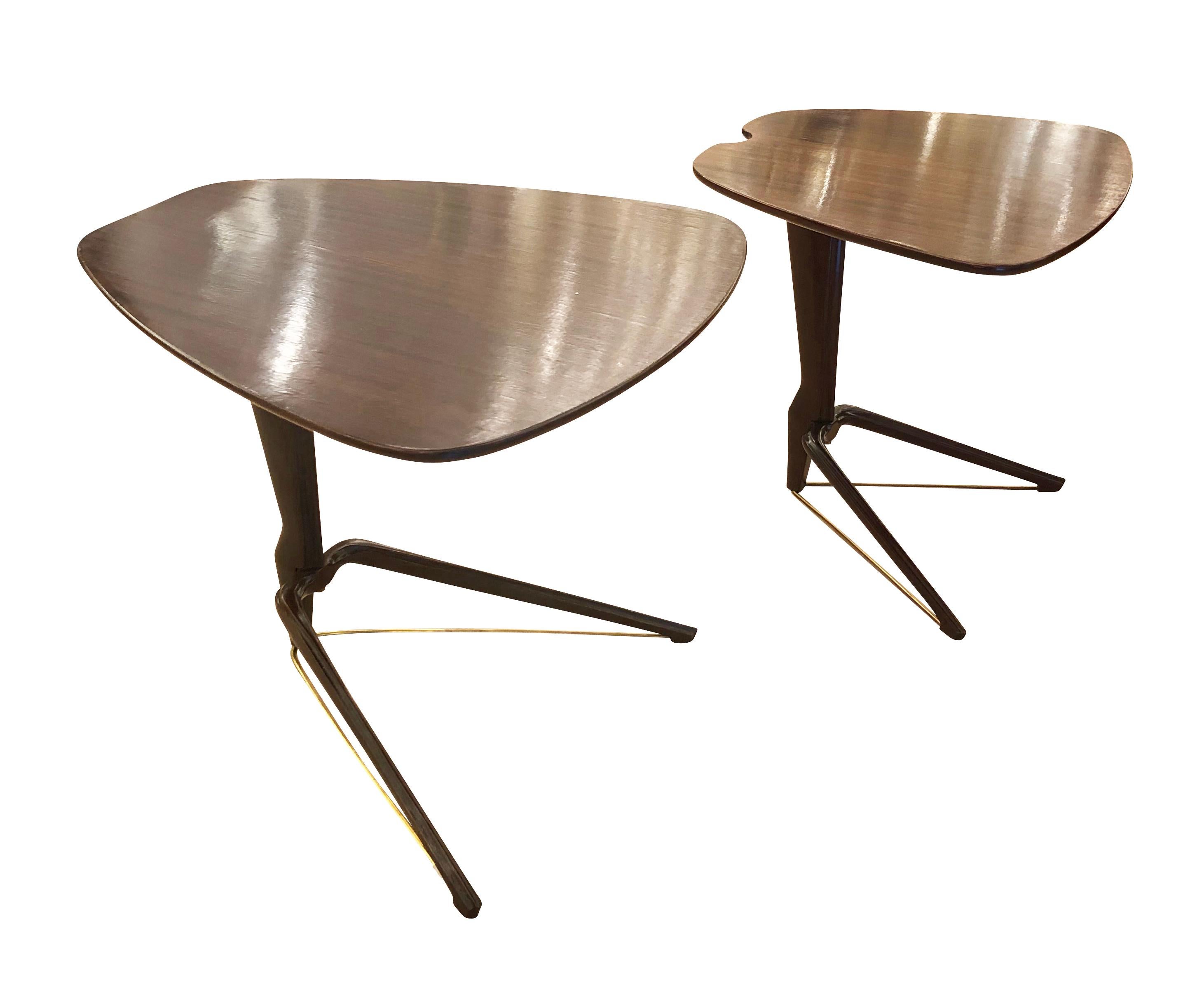 Italian Mid-Century nesting tables made in wood with brass supports. Beautifully designed and contoured tops and legs.

Condition: Excellent vintage condition, minor wear consistent with age and use.

Width: 20” 

Depth: 23.5” minimum when