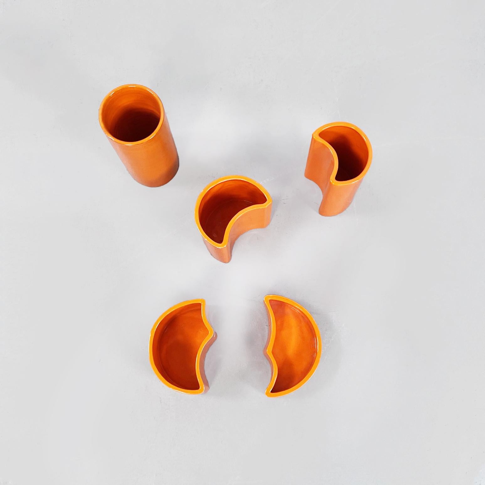 Italian mid-century orange ceramic cylindrical, half-moon and irregular vases, 1970s
Set of five orange ceramic vases. The highest is cylindrical shape, in succession there are two crescent-shaped, while the two lowest are irregular