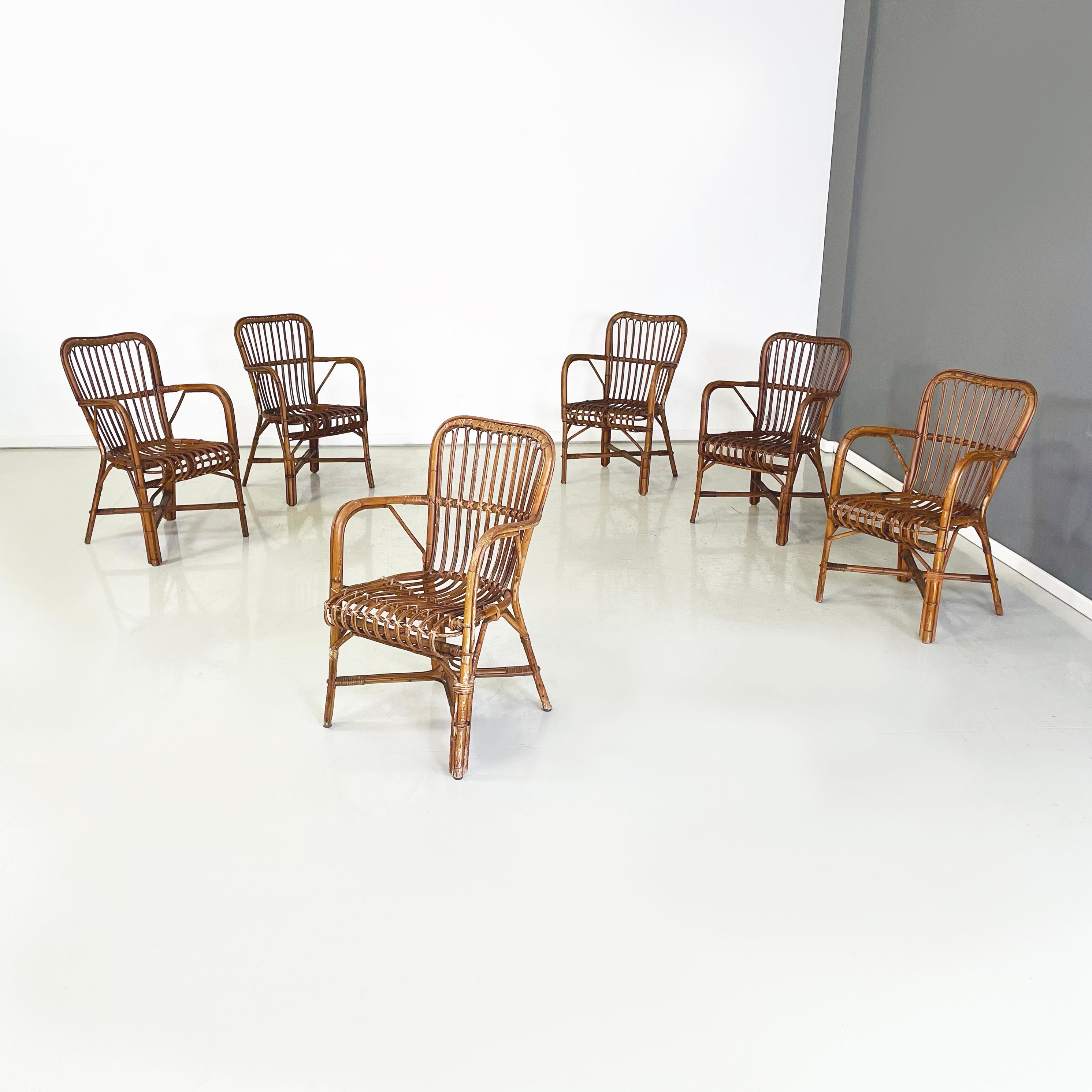 Italian mid-century Outdoor Armchairs in bamboo and rattan, 1960s
Set of6 armchairs with curved armrests in finely woven bamboo of different shades. The legs are joined in the middle by an X-shaped structure. Suitable for outdoor use such as in the