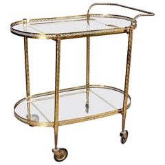 1950s bar cart Italian Mid-Century Oval Bar Cart in Brass and Glass, 1950s