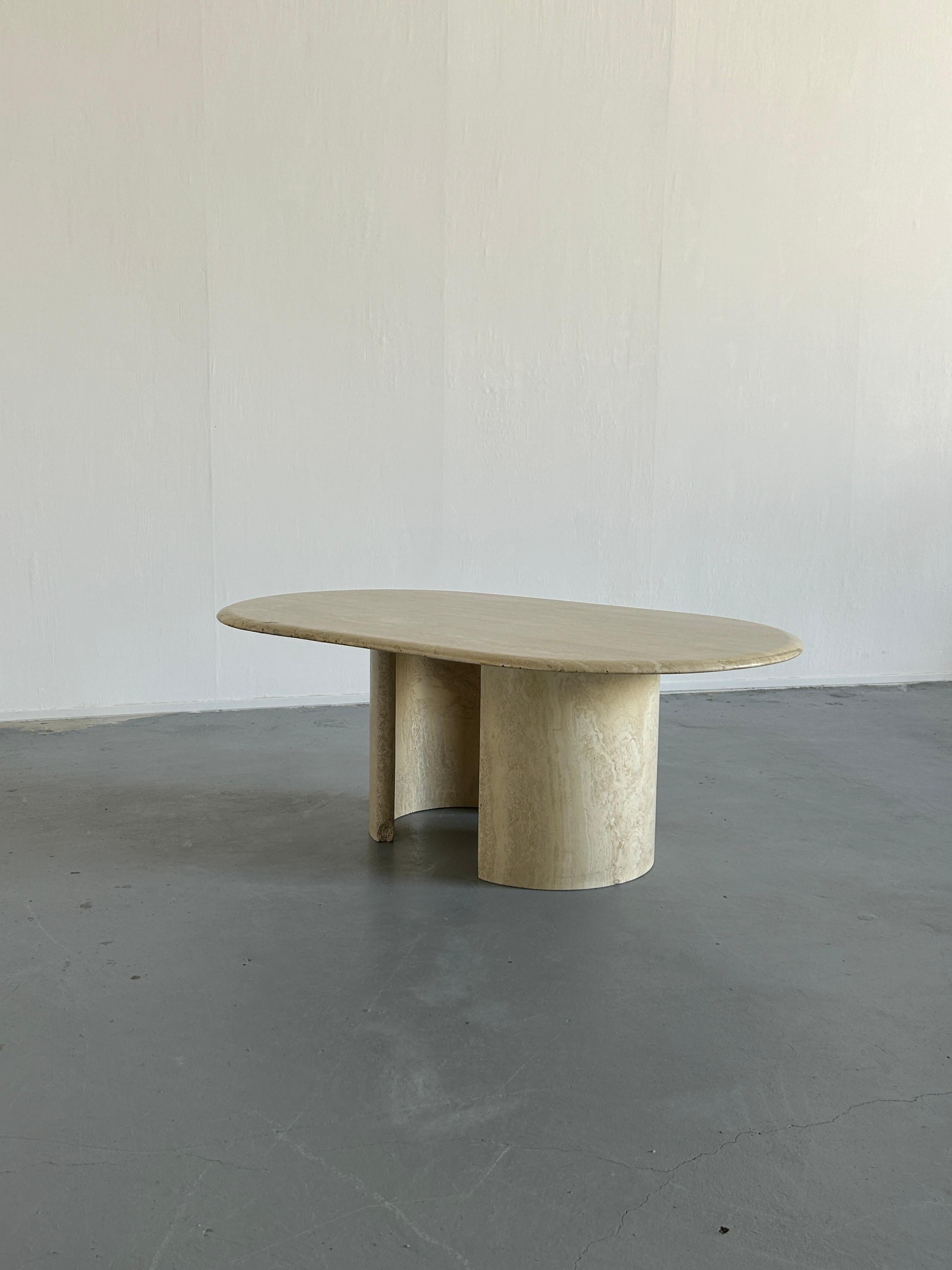 A beautiful original 1980s Italian travertine coffee table. 

Consists of a large and beautiful marble top with rounded edges and two independent semi-circle legs which can be adjusted per wish.
All parts made from full travertine stone of