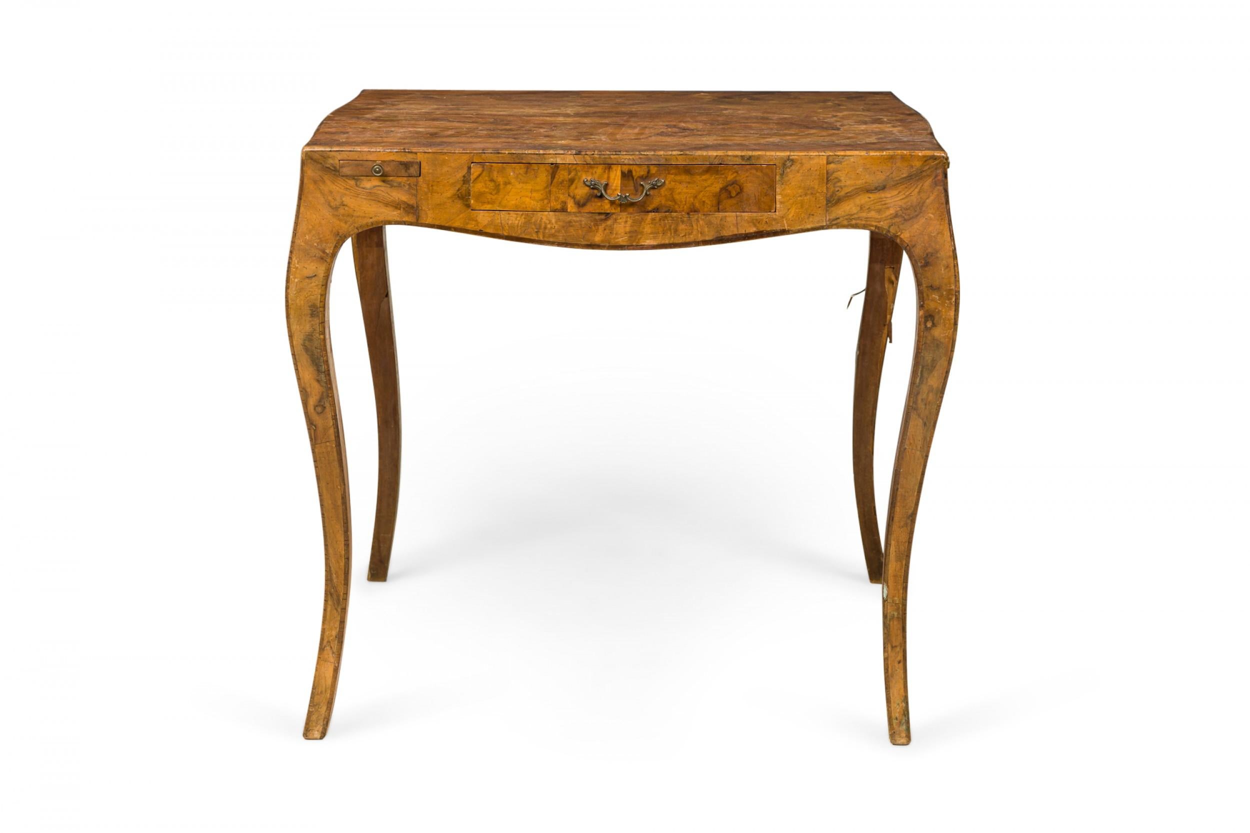 Italian Mid-Century square top game table with oyster burl veneer and a single drawer with a brass drawer pull, resting on four curved legs.
